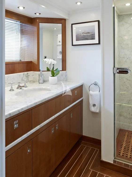 a bathroom with a sink and a mirror aboard HEAVENLY DAZE Yacht for Sale