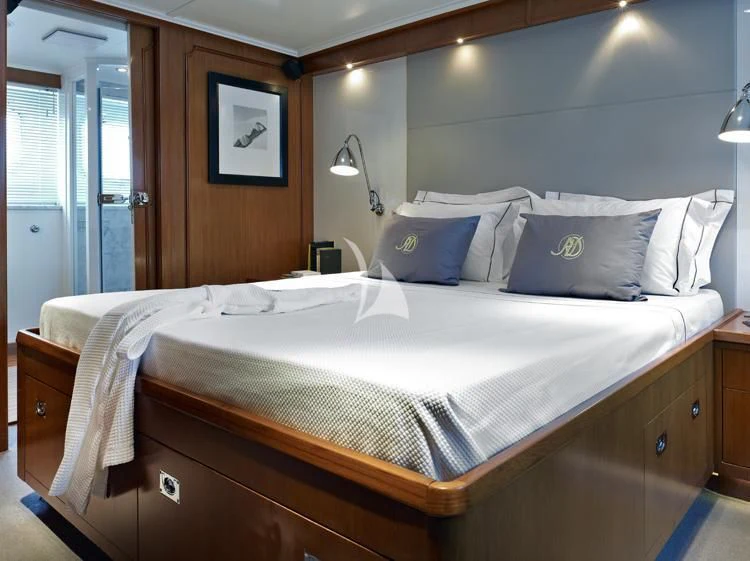 a bed with white sheets aboard HEAVENLY DAZE Yacht for Sale