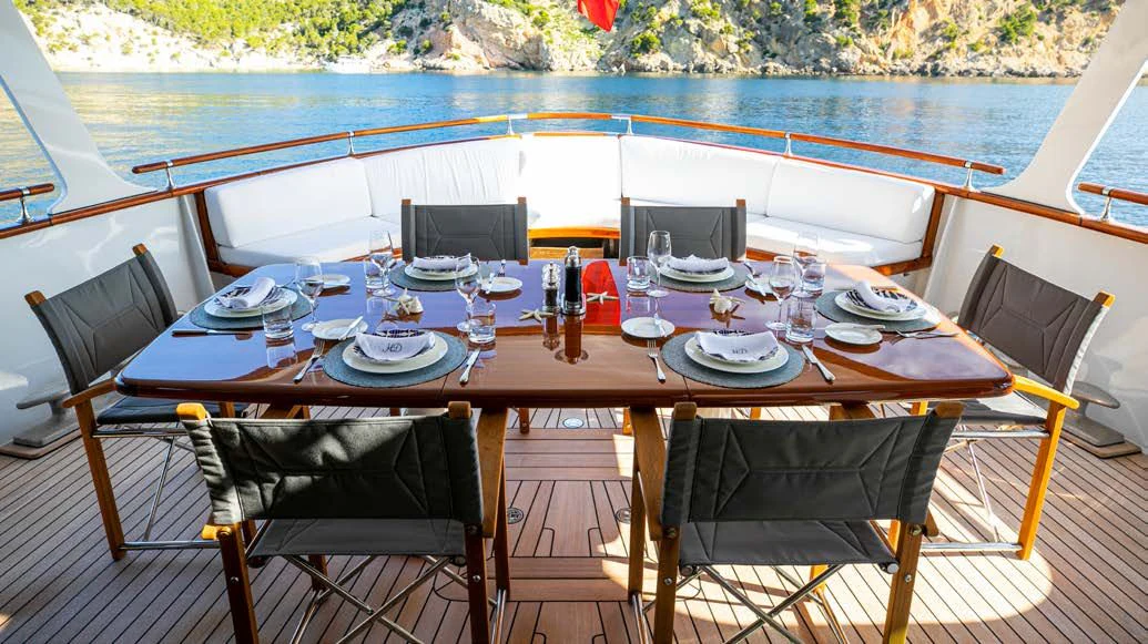 a table set for a dinner aboard HEAVENLY DAZE Yacht for Sale