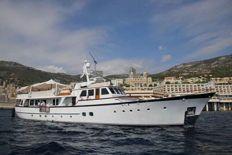 a large white boat in the water aboard HEAVENLY DAZE Yacht for Sale