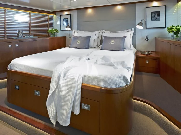 a bed with white sheets aboard HEAVENLY DAZE Yacht for Sale