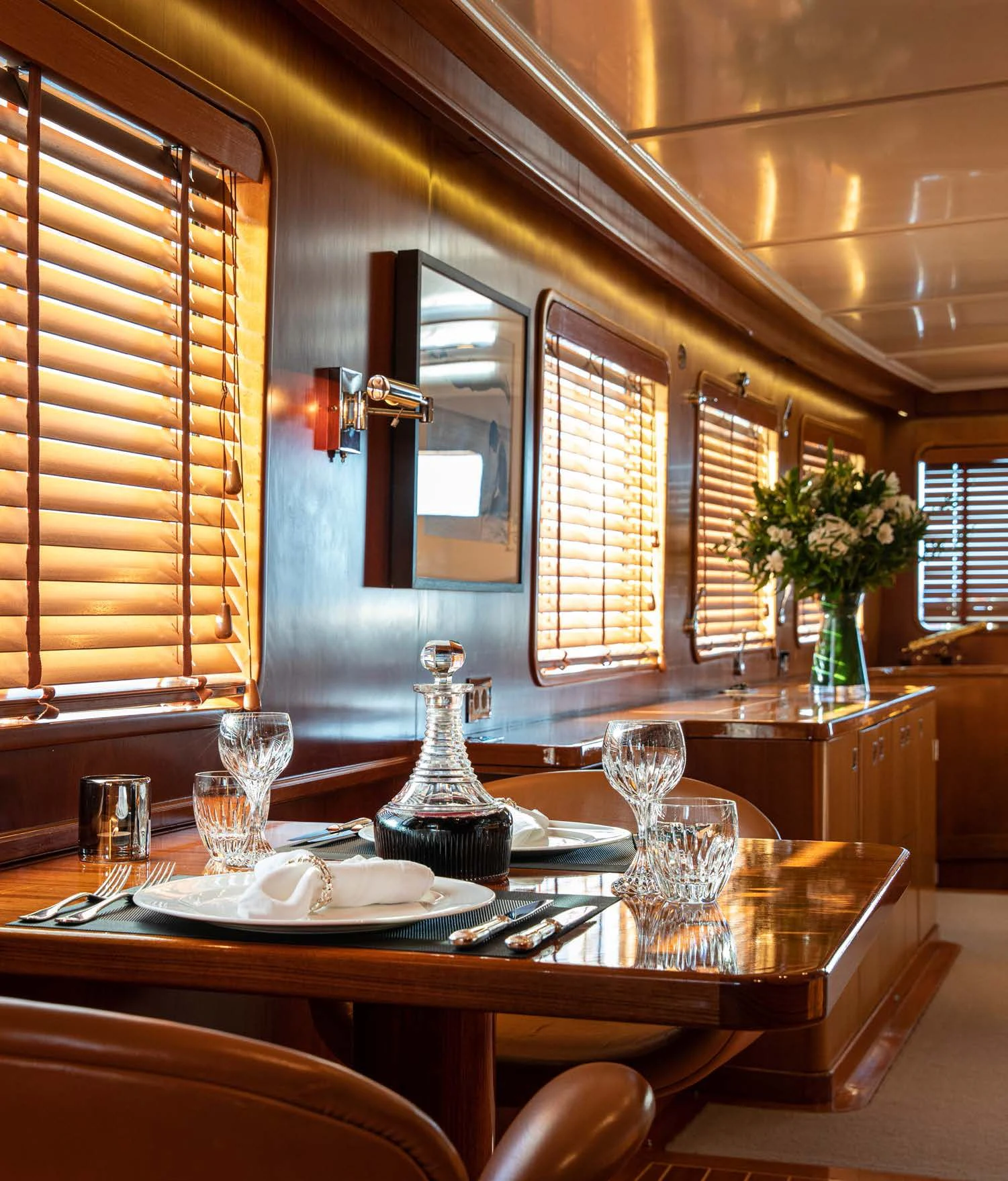 a dining room with a table and chairs aboard HEAVENLY DAZE Yacht for Sale