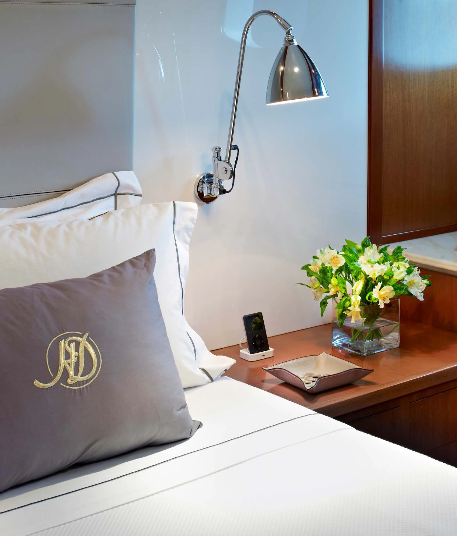a bed with a white pillow and a white pillow on it aboard HEAVENLY DAZE Yacht for Sale