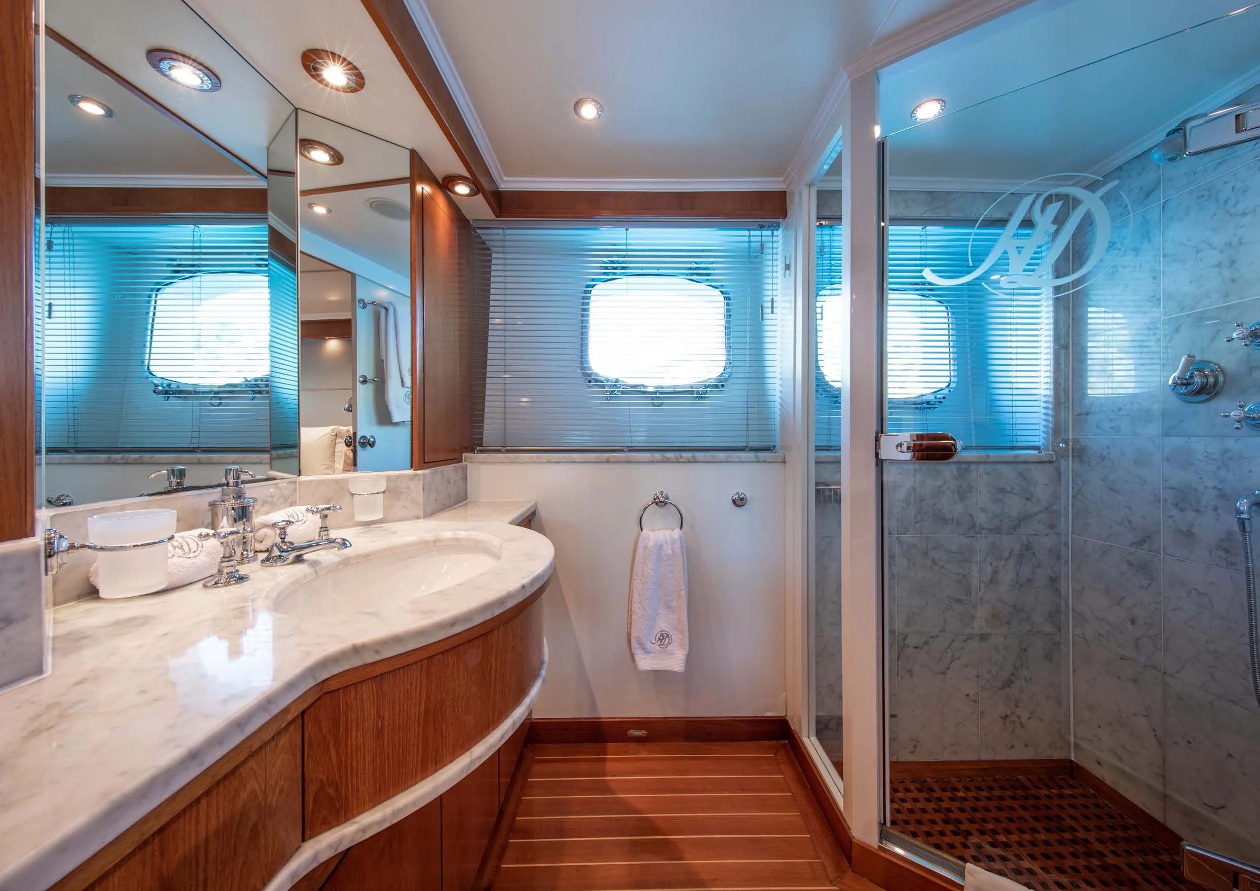 a bathroom with a large mirror aboard HEAVENLY DAZE Yacht for Sale