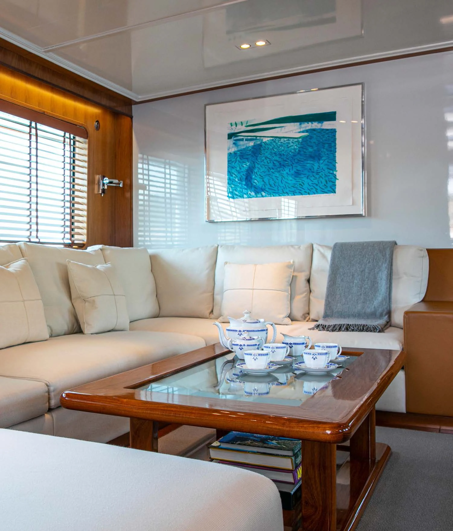 a living room with a table and couches aboard HEAVENLY DAZE Yacht for Sale