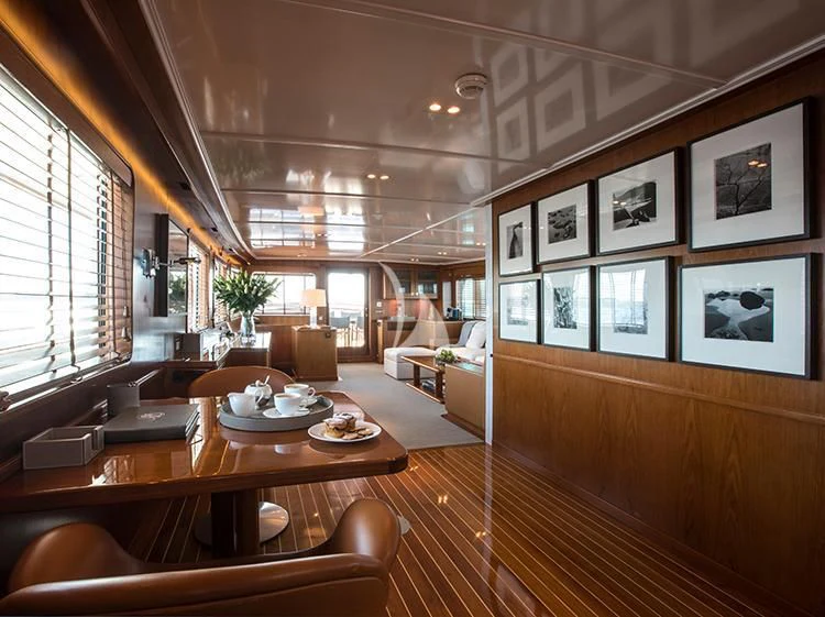 a room with a table and chairs aboard HEAVENLY DAZE Yacht for Sale