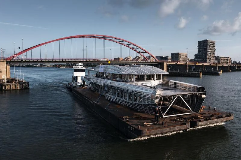 a large boat on the water aboard INGOT Yacht for Sale