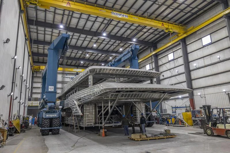 a large warehouse with several machines aboard INGOT Yacht for Sale