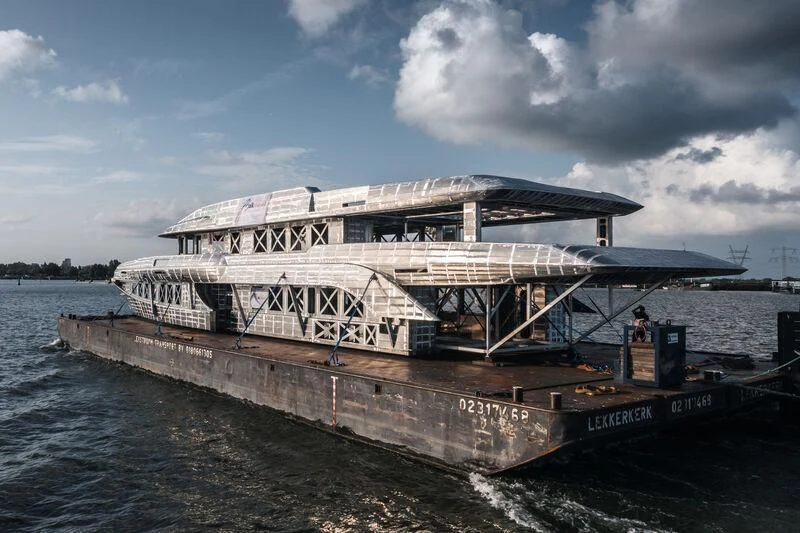 a large boat on the water aboard INGOT Yacht for Sale