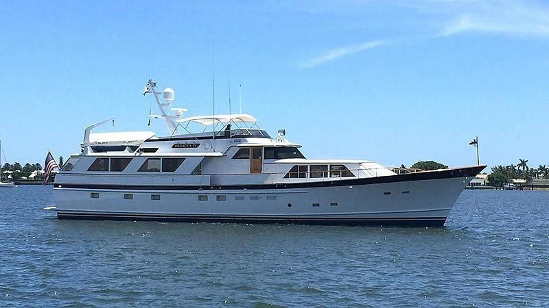 a large boat on the water aboard PANACEA IV Yacht for Sale