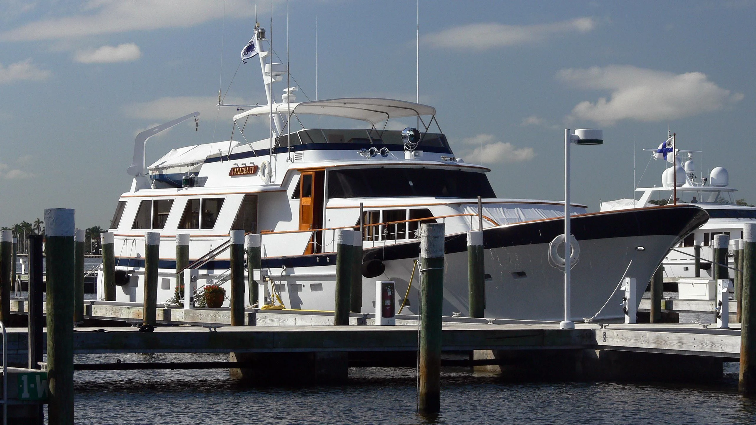 a large white boat docked aboard PANACEA IV Yacht for Sale