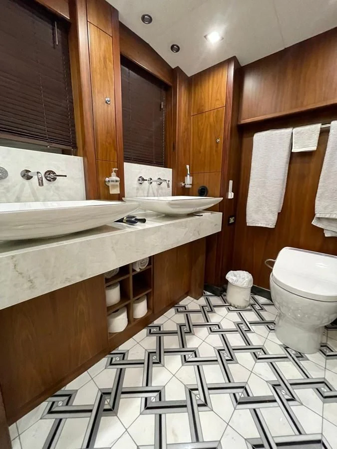 a bathroom with a sink toilet and a bathtub aboard SOLARIS Yacht for Sale