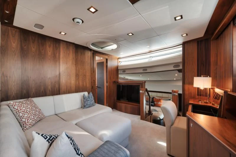 a living room with a couch and a fireplace aboard SOLARIS Yacht for Sale