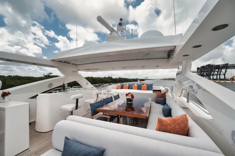 a boat with a table and chairs aboard SOLARIS Yacht for Sale