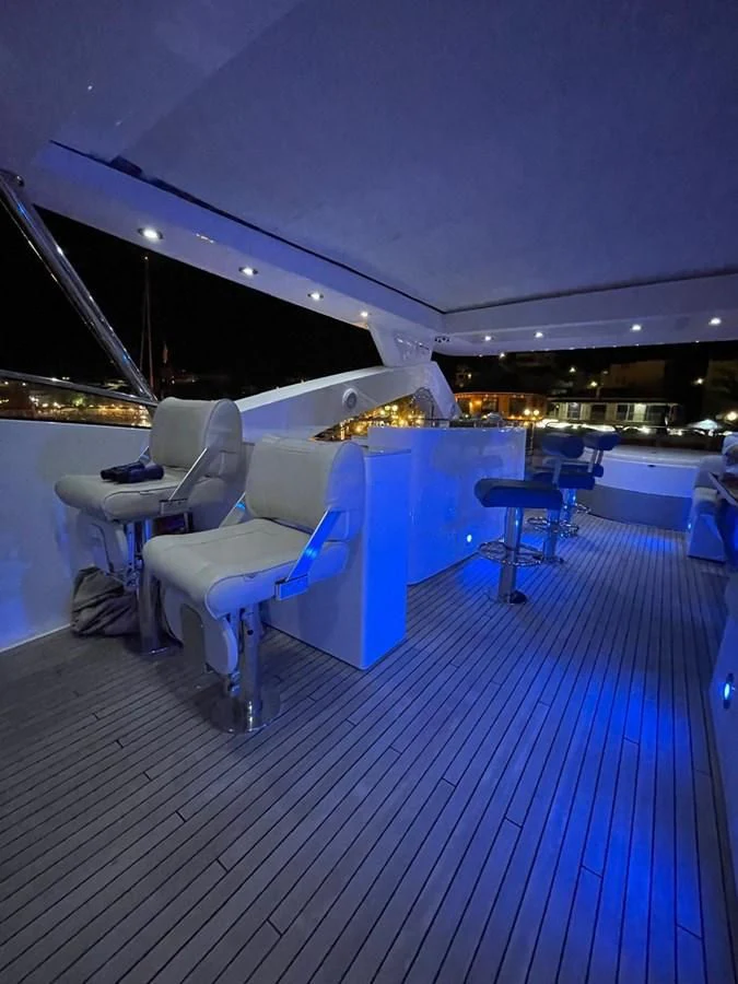 a room with a table and chairs aboard SOLARIS Yacht for Sale