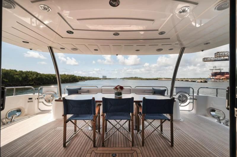 a table and chairs on a deck aboard SOLARIS Yacht for Sale