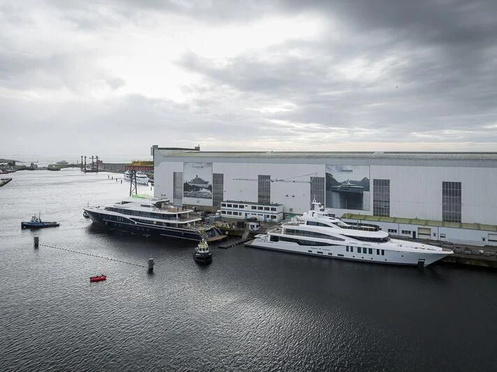 a body of water with boats in it and a large building in the background aboard MARSA Yacht for Sale