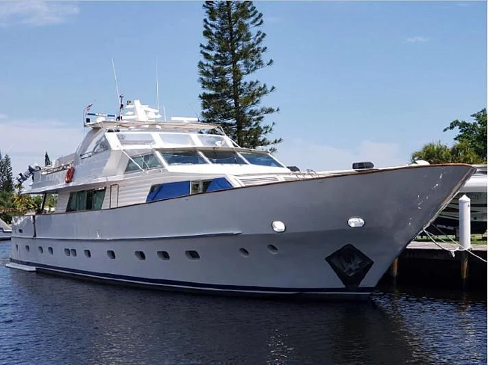 a white yacht on the water aboard TROTTER Yacht for Sale