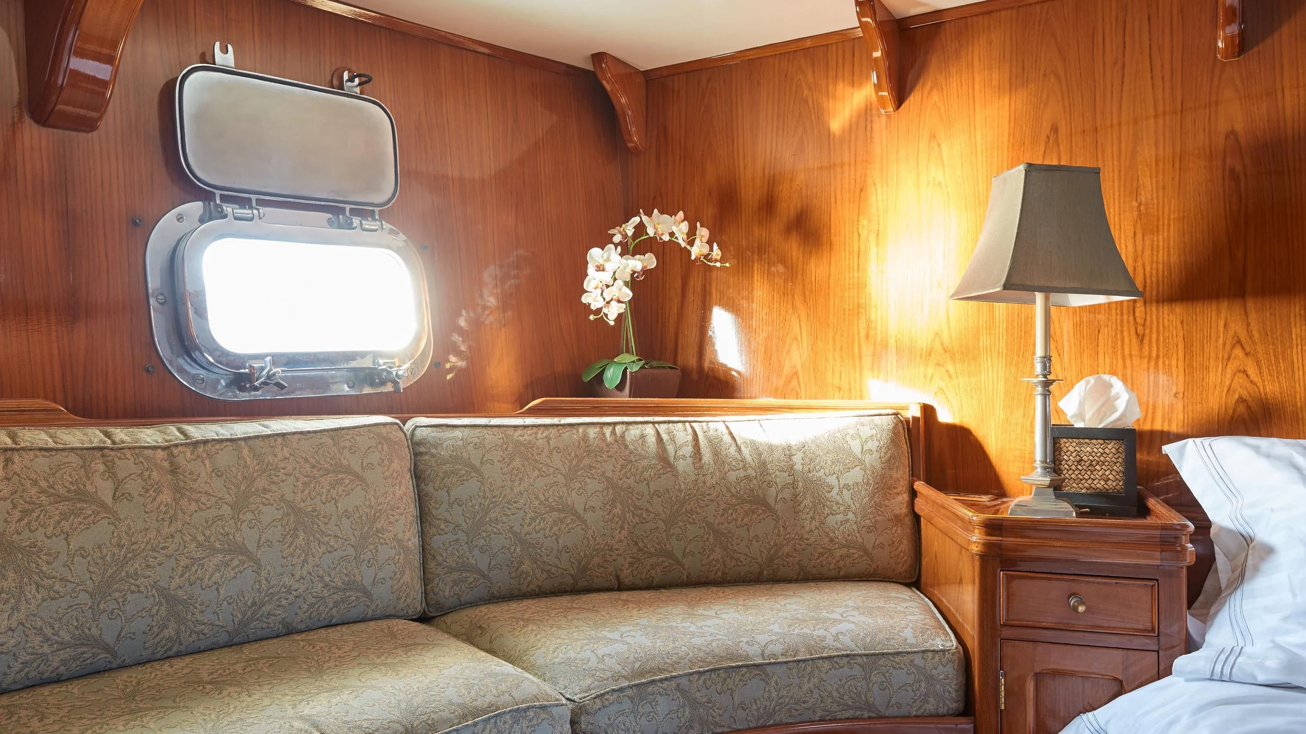 a couch with a flower on it aboard SLOW DANCE Yacht for Sale