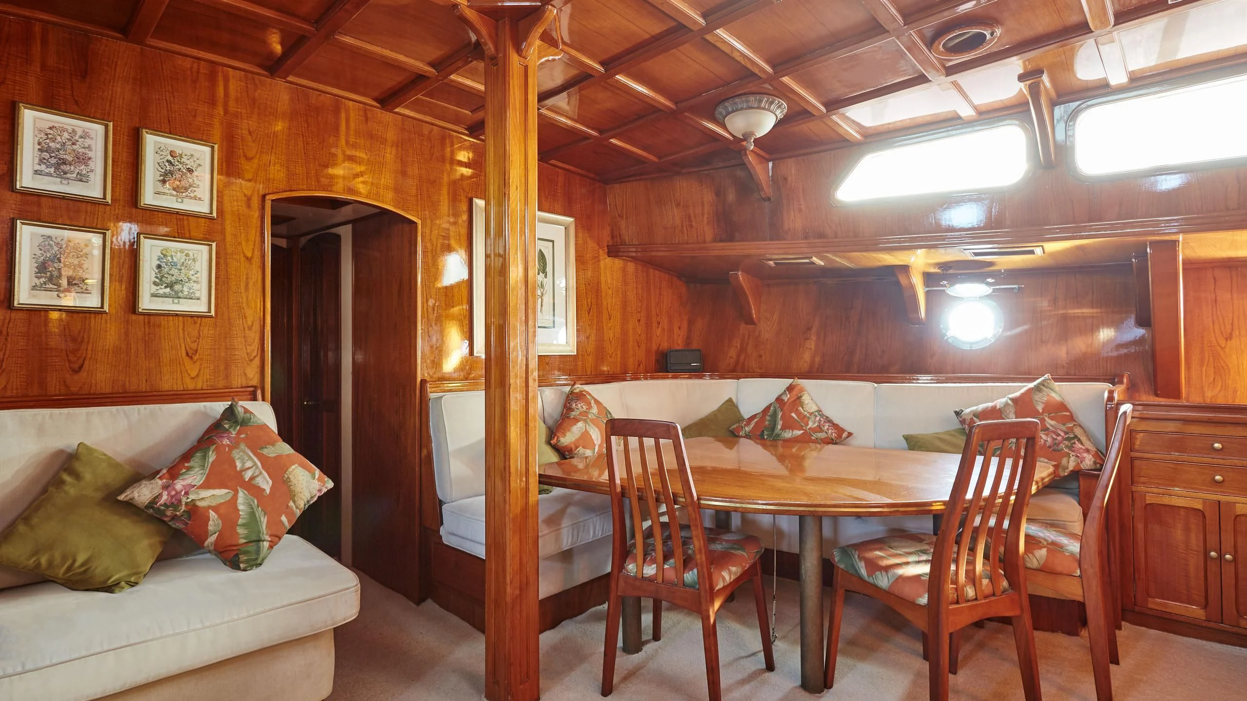 a room with a couch and a table and a bed aboard SLOW DANCE Yacht for Sale