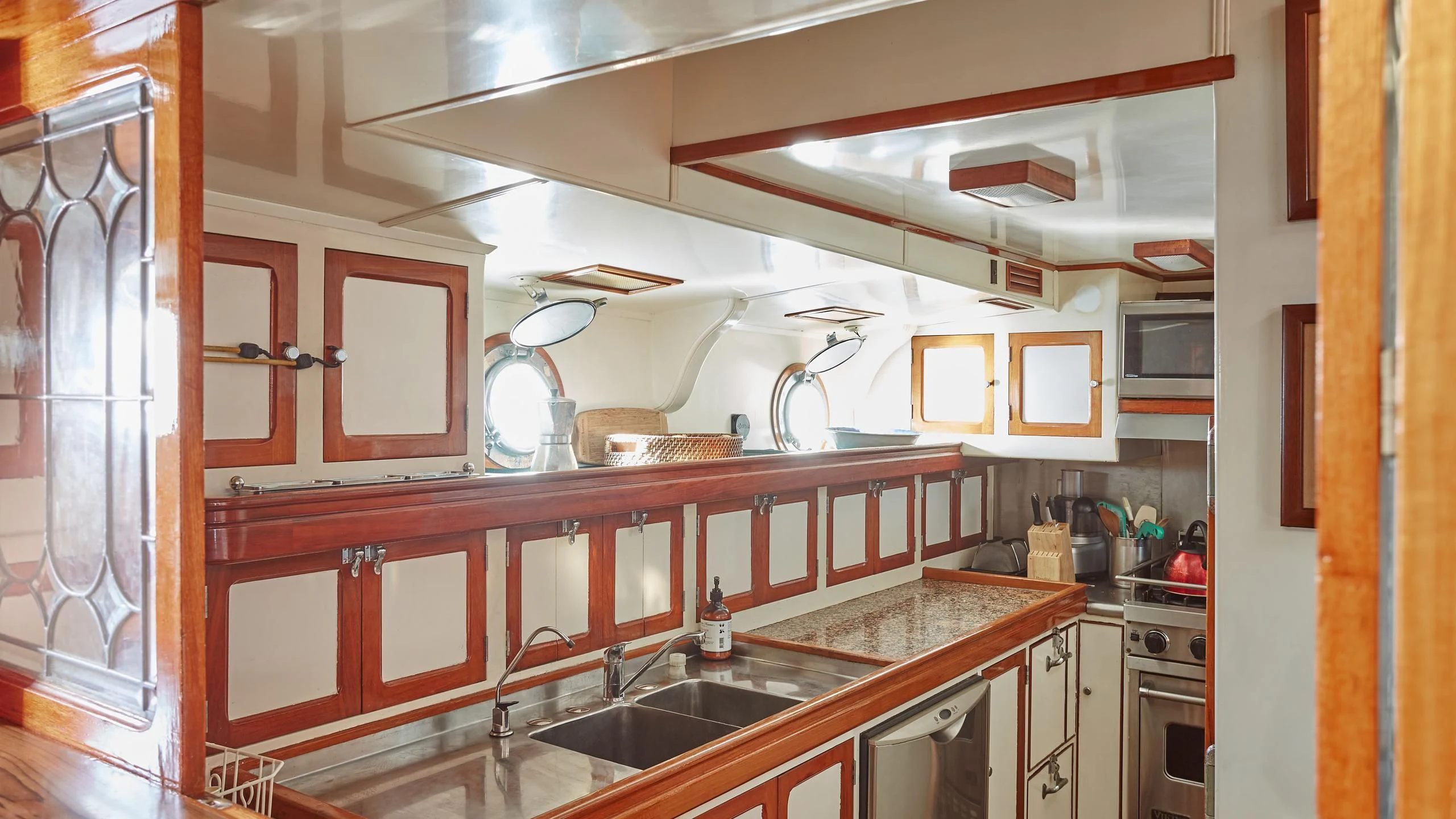 a kitchen with a sink and cabinets aboard SLOW DANCE Yacht for Sale