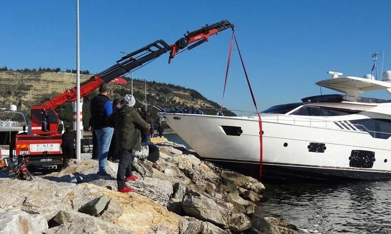 a boat being loaded with gravel aboard GEMINI Yacht for Sale