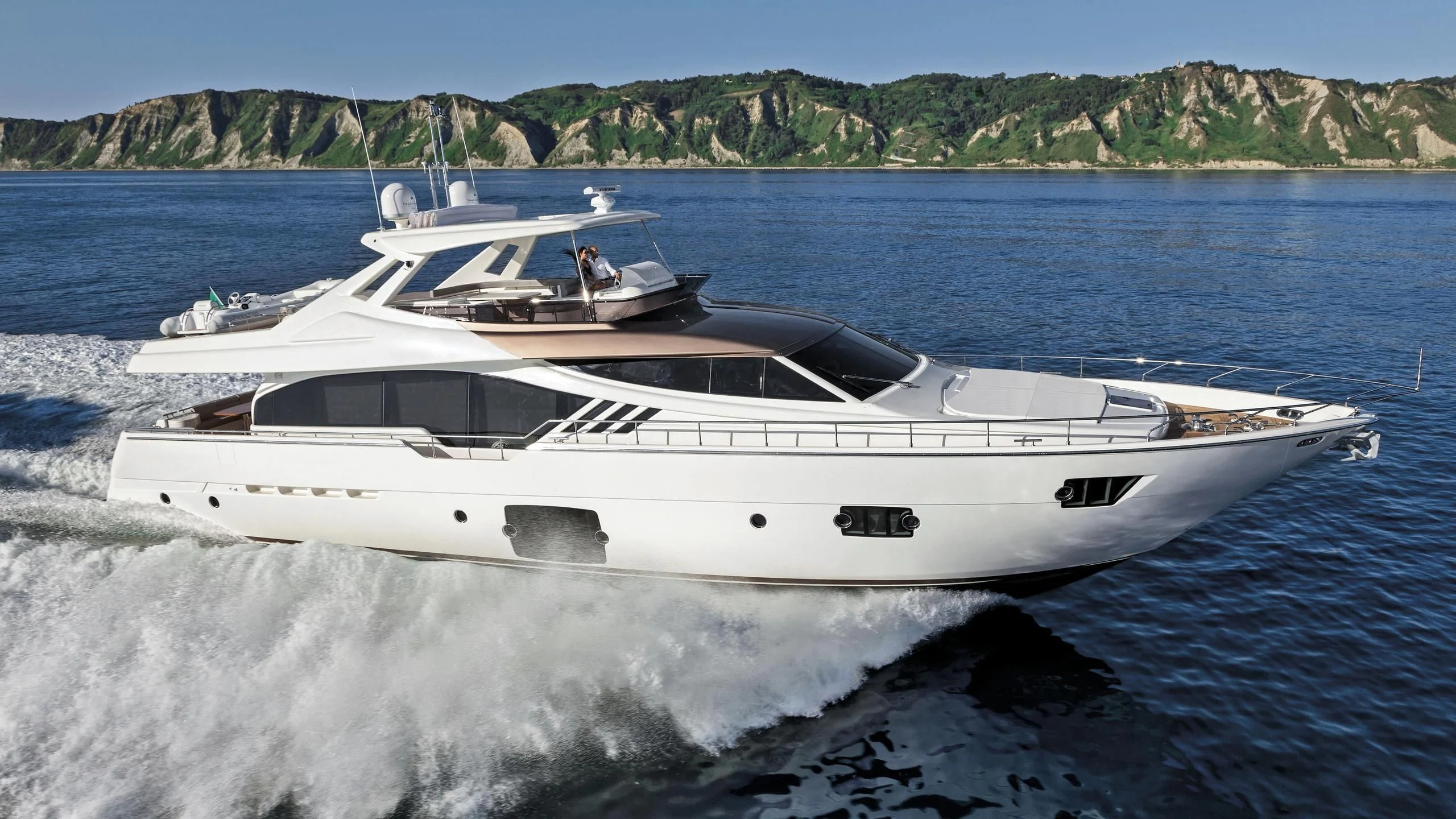 a white yacht on the water aboard GEMINI Yacht for Sale