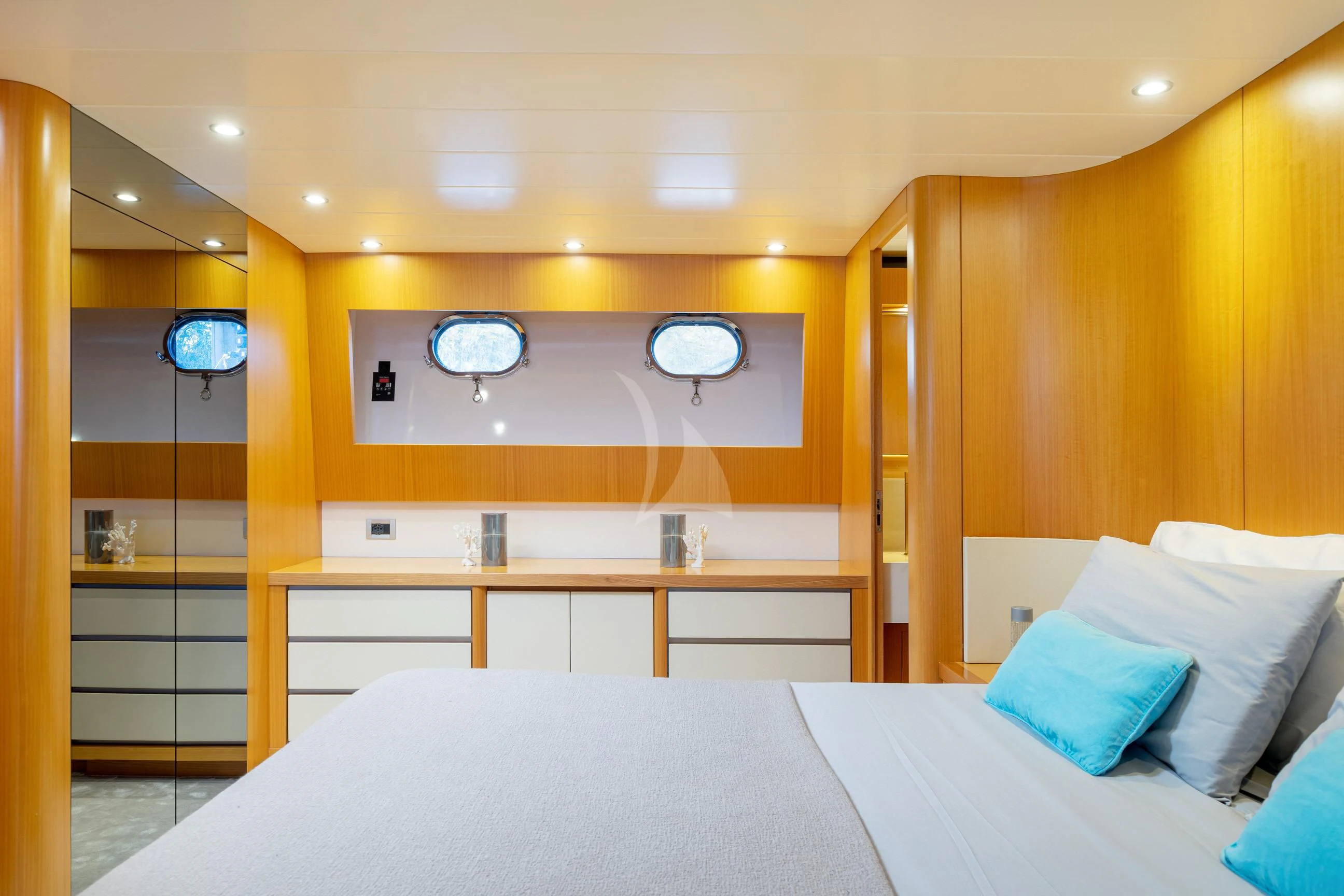 a room with a bed and a mirror aboard MINOU Yacht for Sale