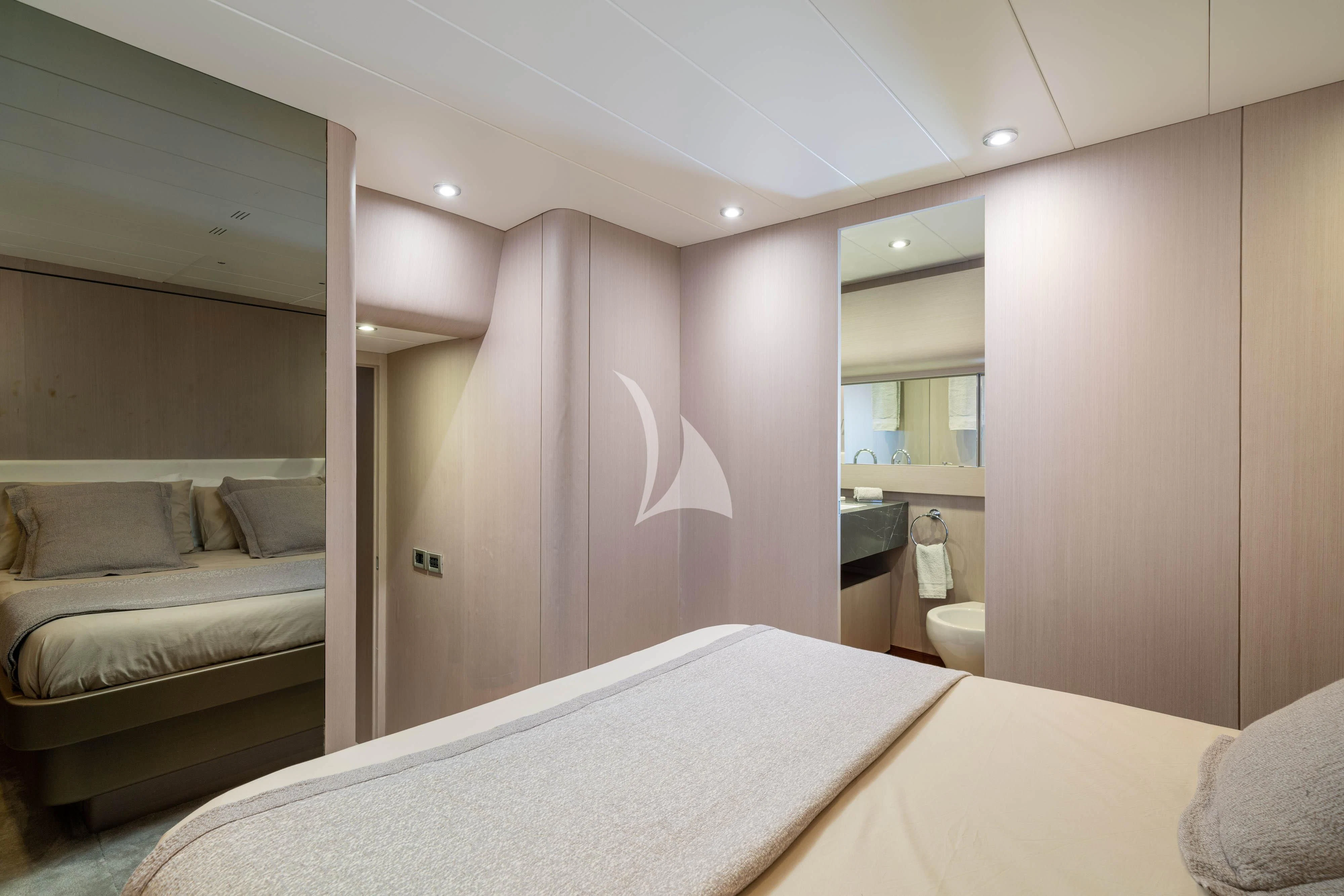 a room with a bed and a mirror aboard MINOU Yacht for Sale