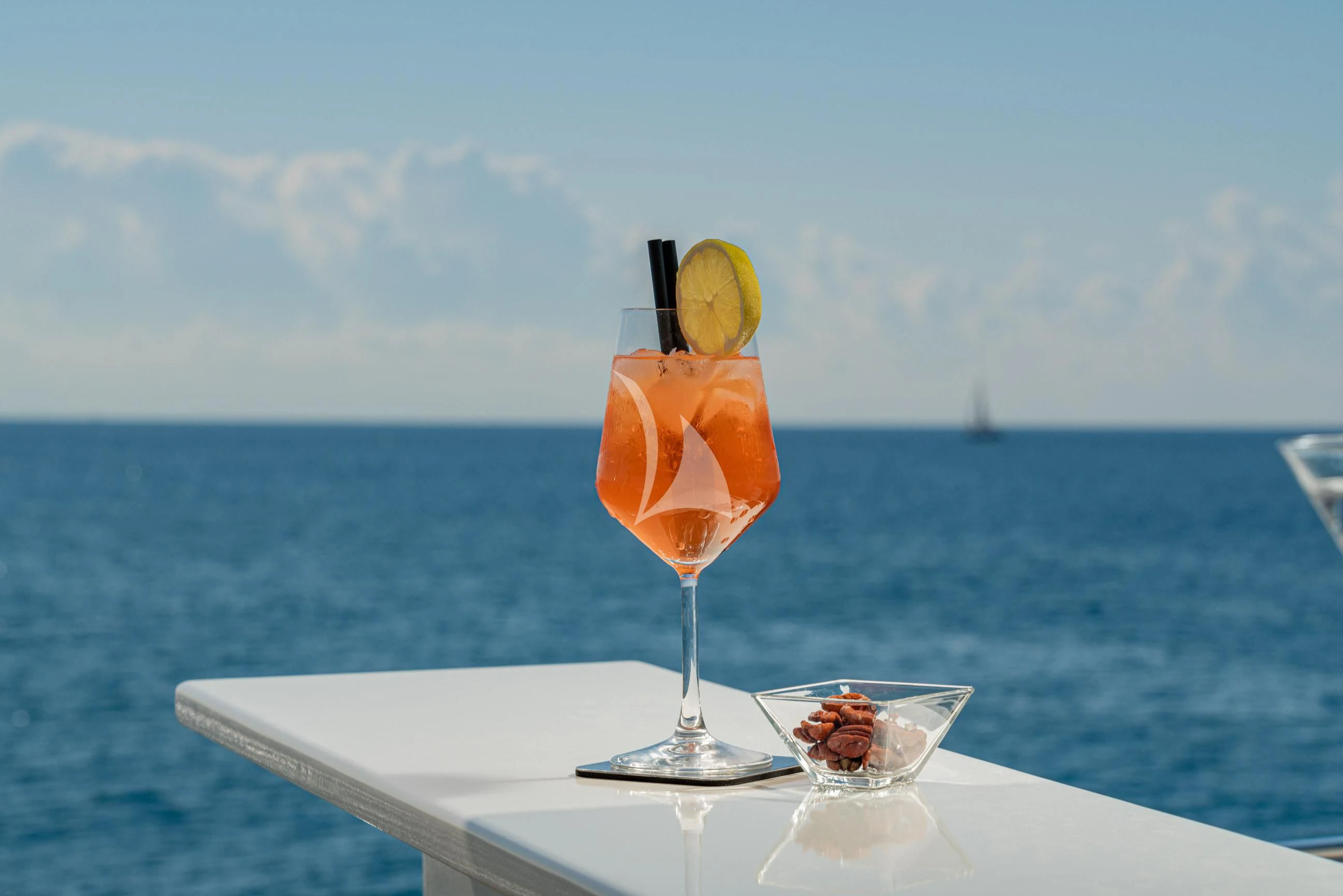 a drink on the table aboard MINOU Yacht for Sale