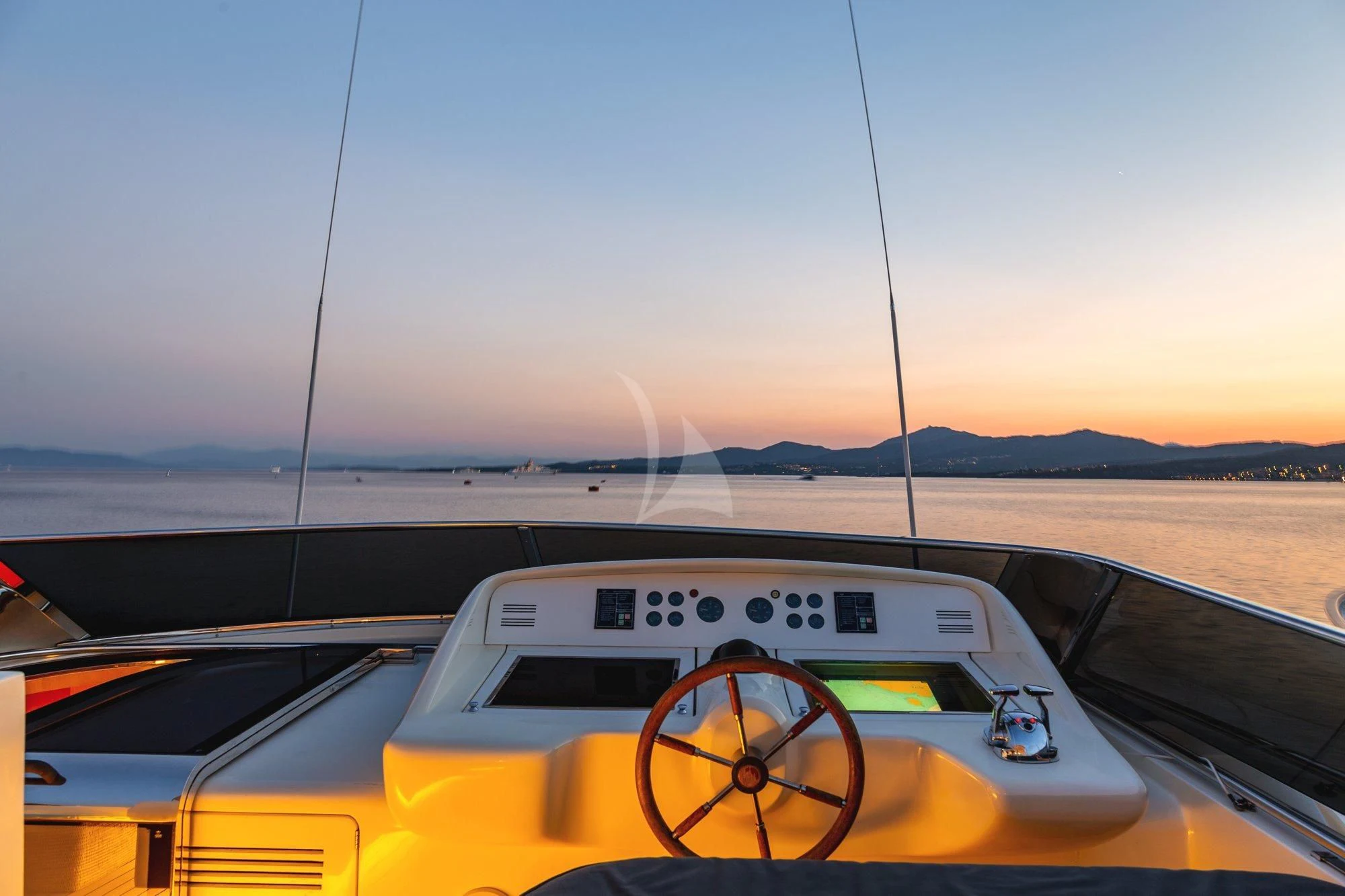 a yellow car on a road aboard MINOU Yacht for Sale