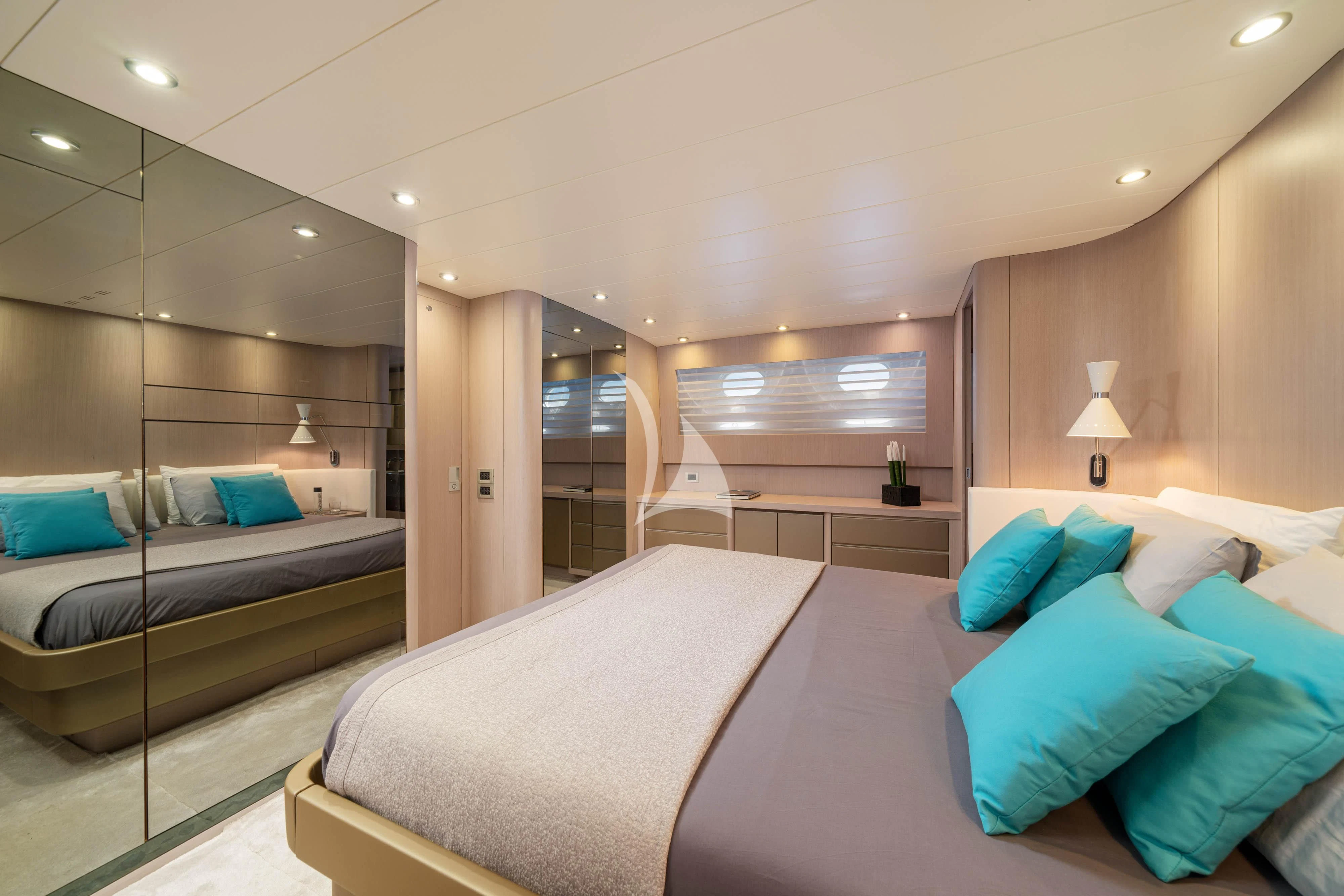 a room with a bed and a mirror aboard MINOU Yacht for Sale
