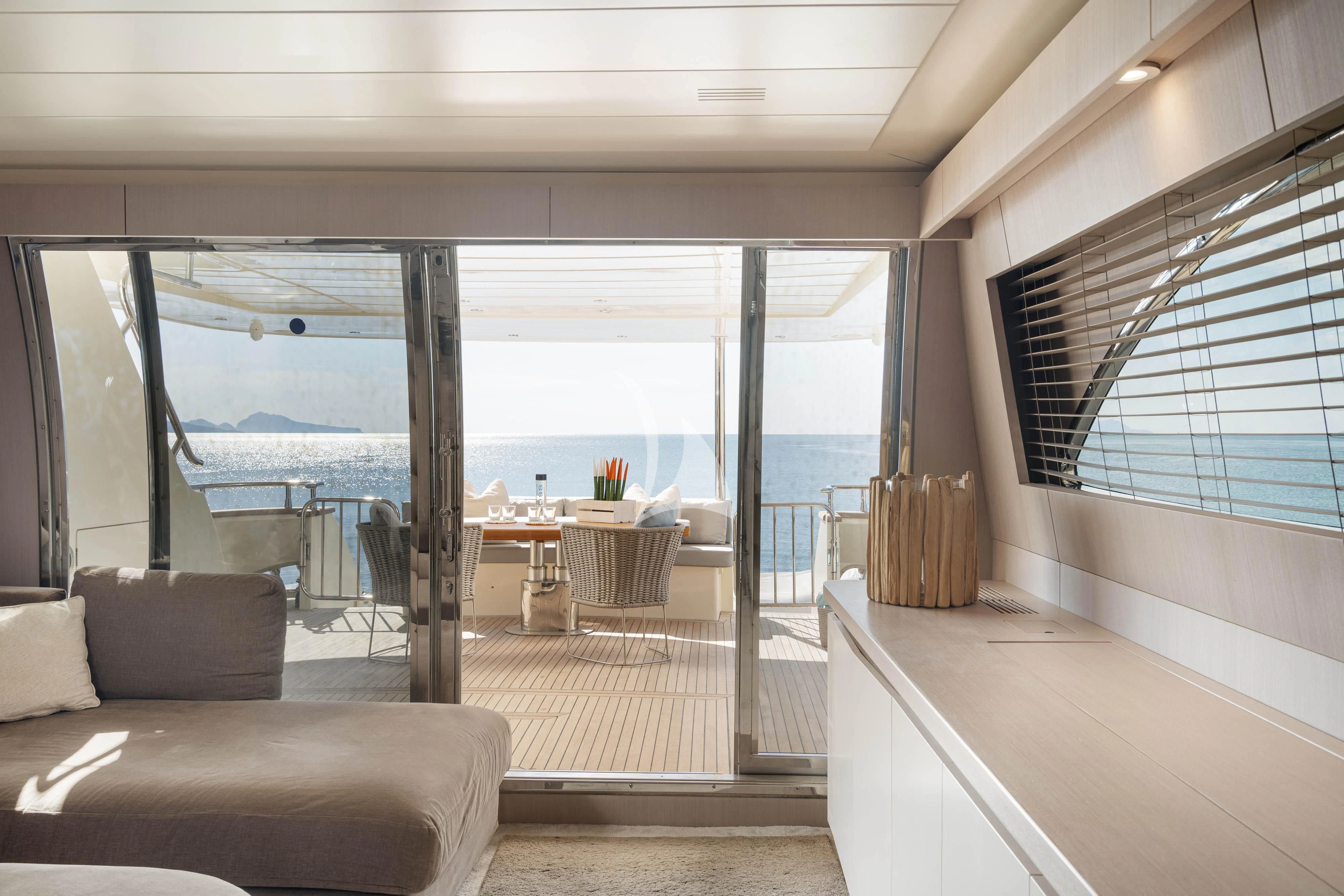 a room with a view of the ocean and the deck aboard MINOU Yacht for Sale