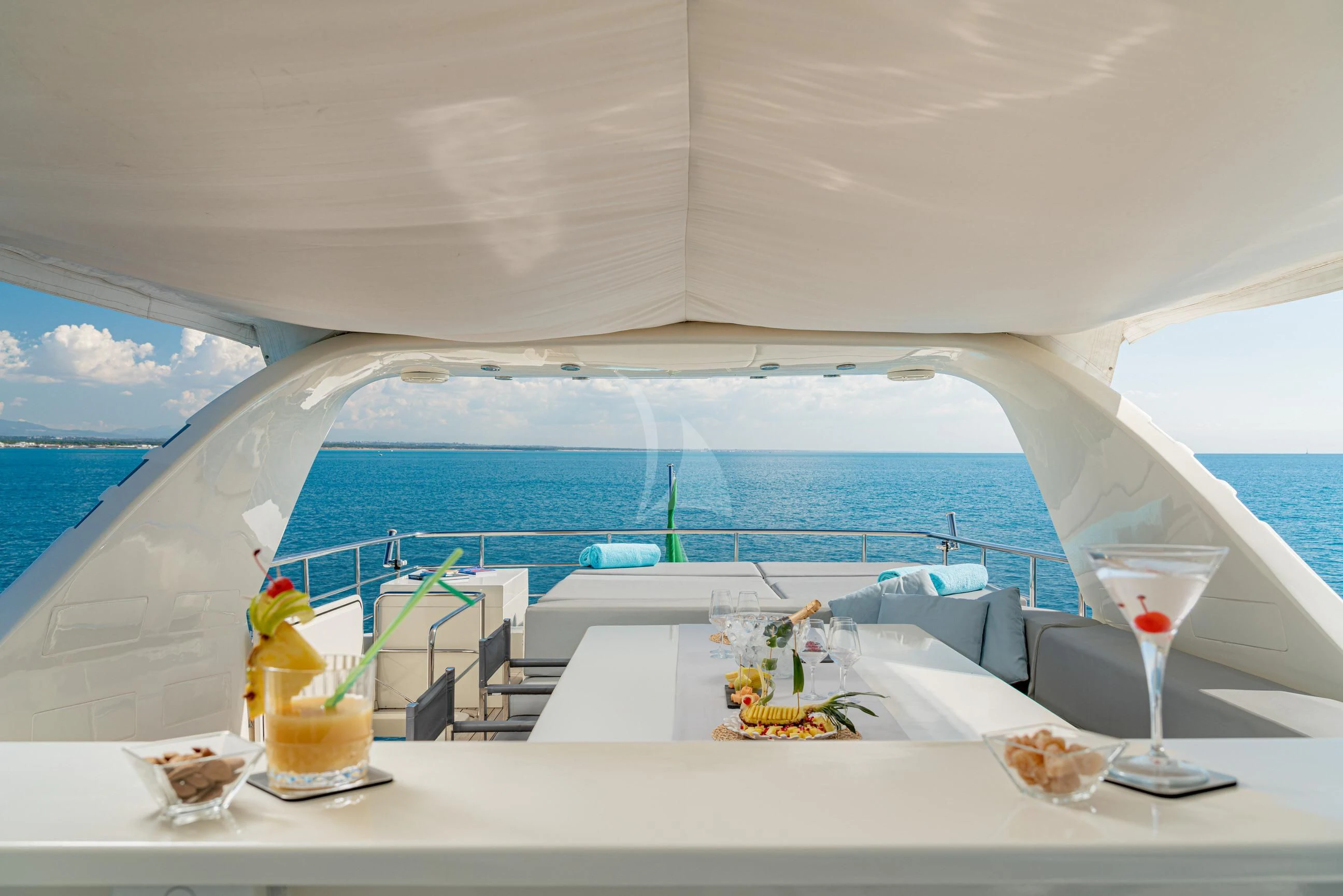 a table with food and drinks on it aboard MINOU Yacht for Sale