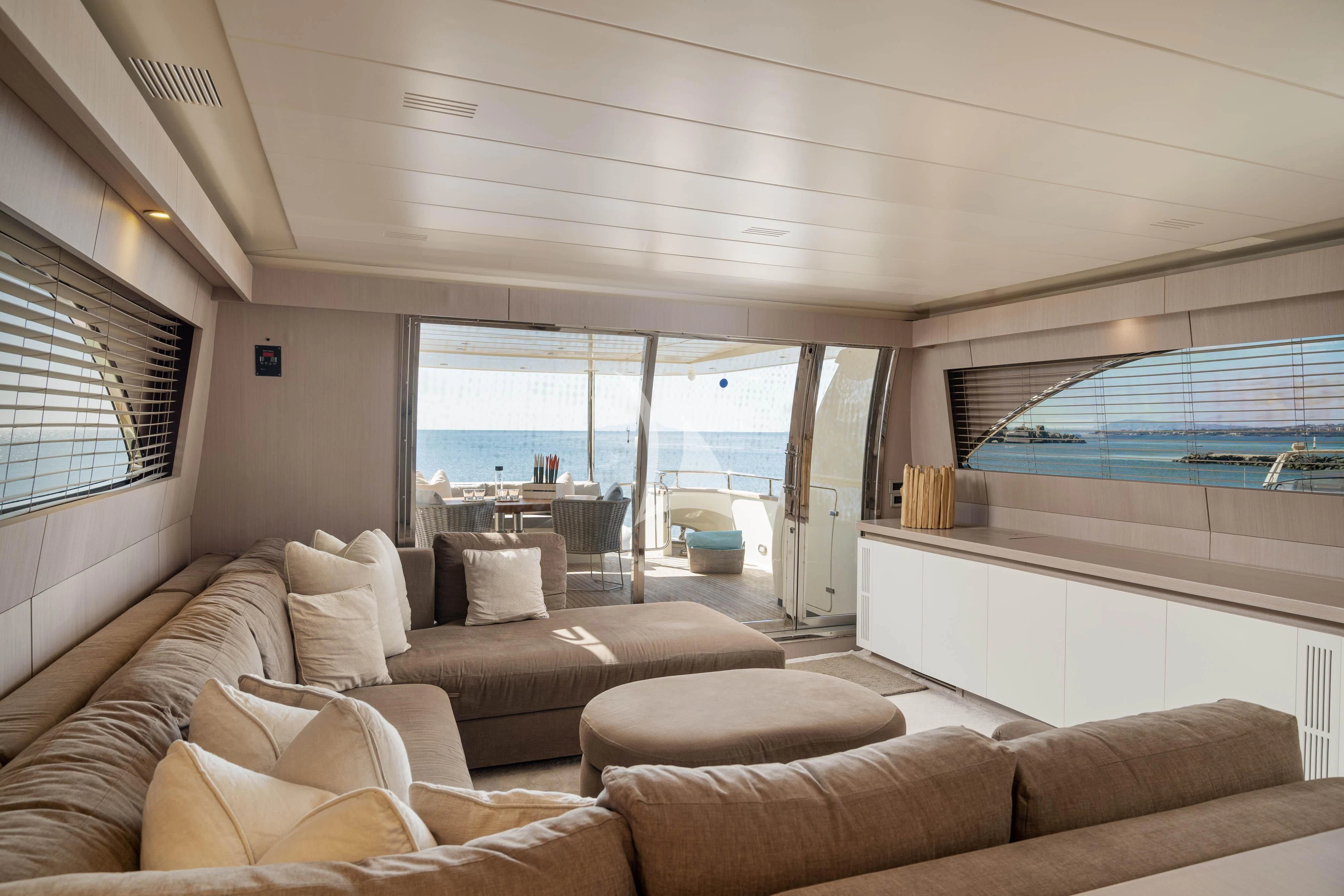 a living room with a large window aboard MINOU Yacht for Sale