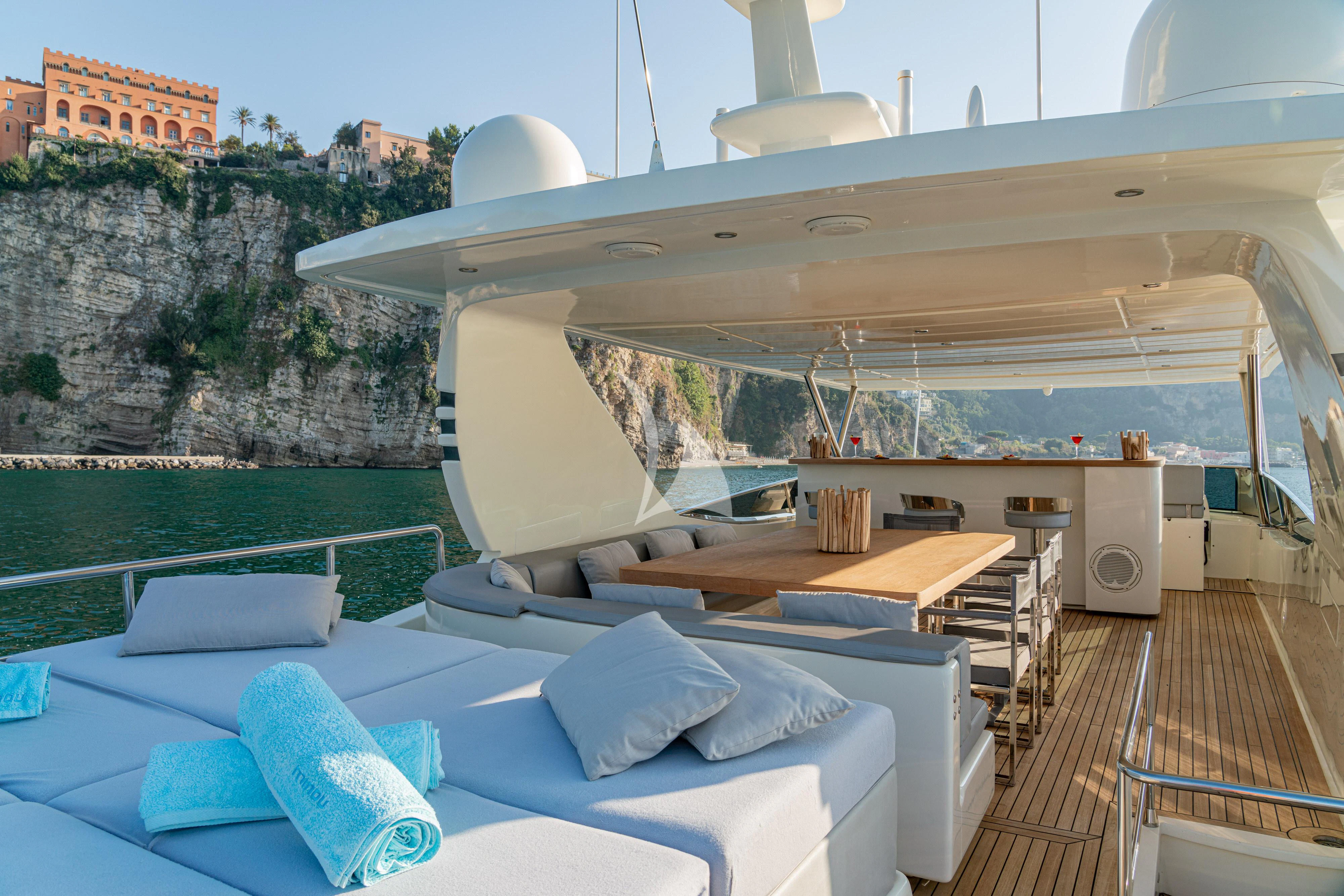 a room with a large bed and a large white building with a large window aboard MINOU Yacht for Sale