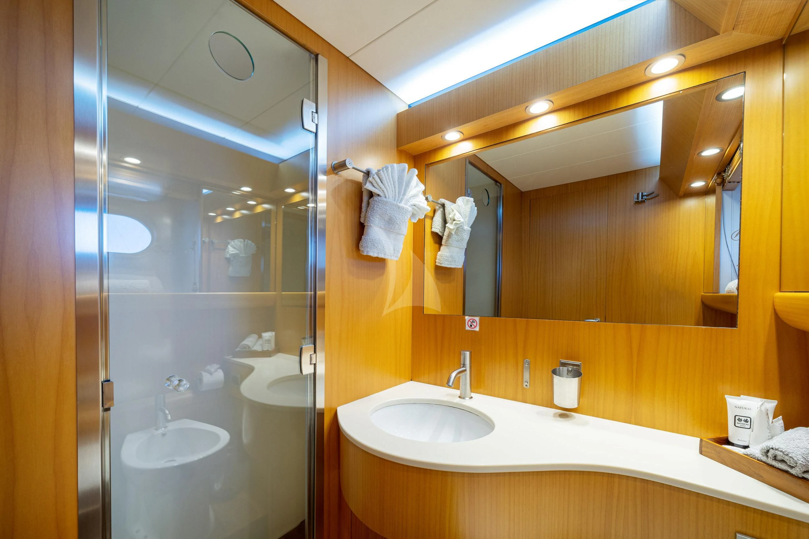 a bathroom with a large mirror aboard MINOU Yacht for Sale