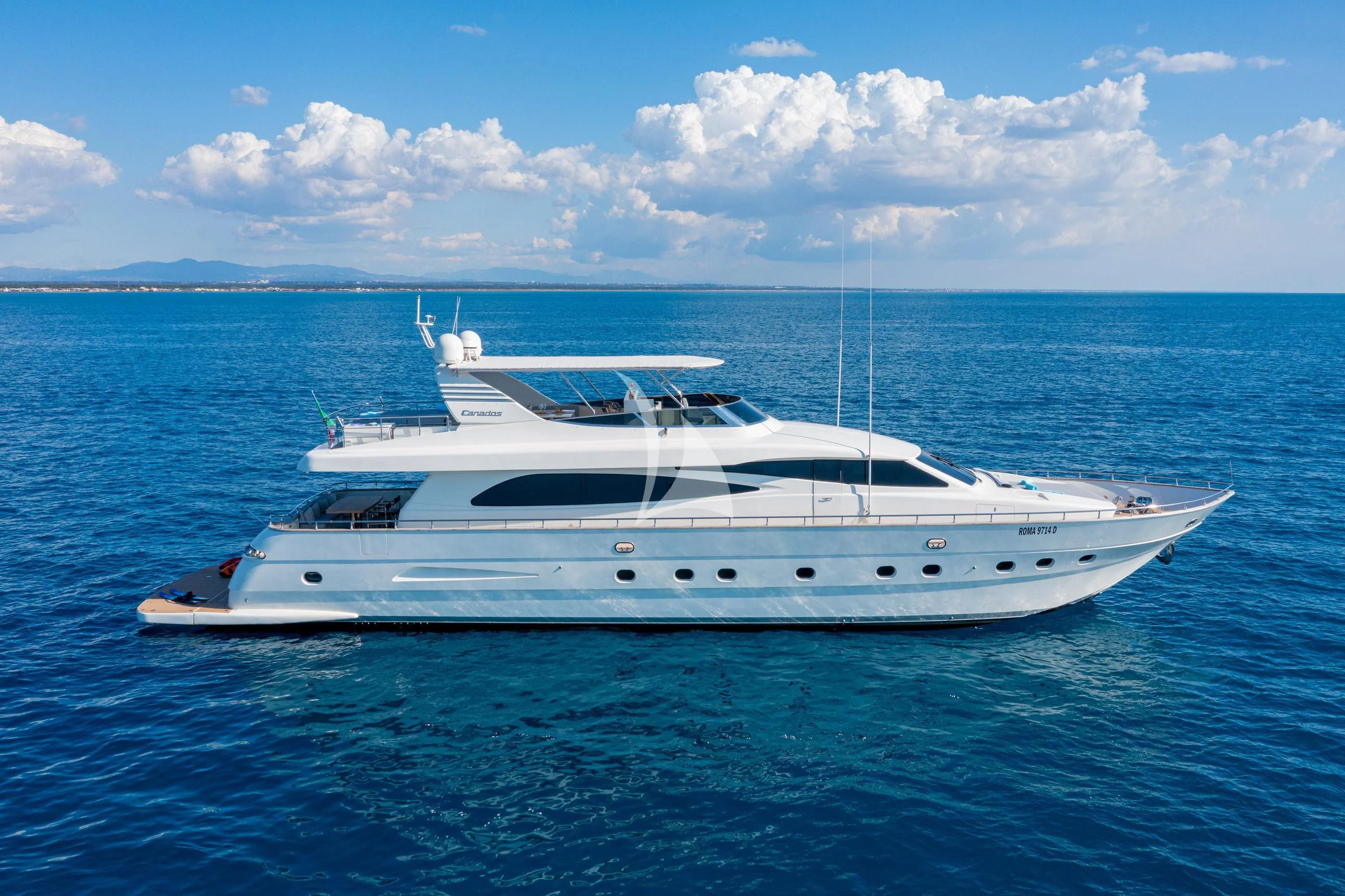 a white yacht in the water aboard MINOU Yacht for Sale