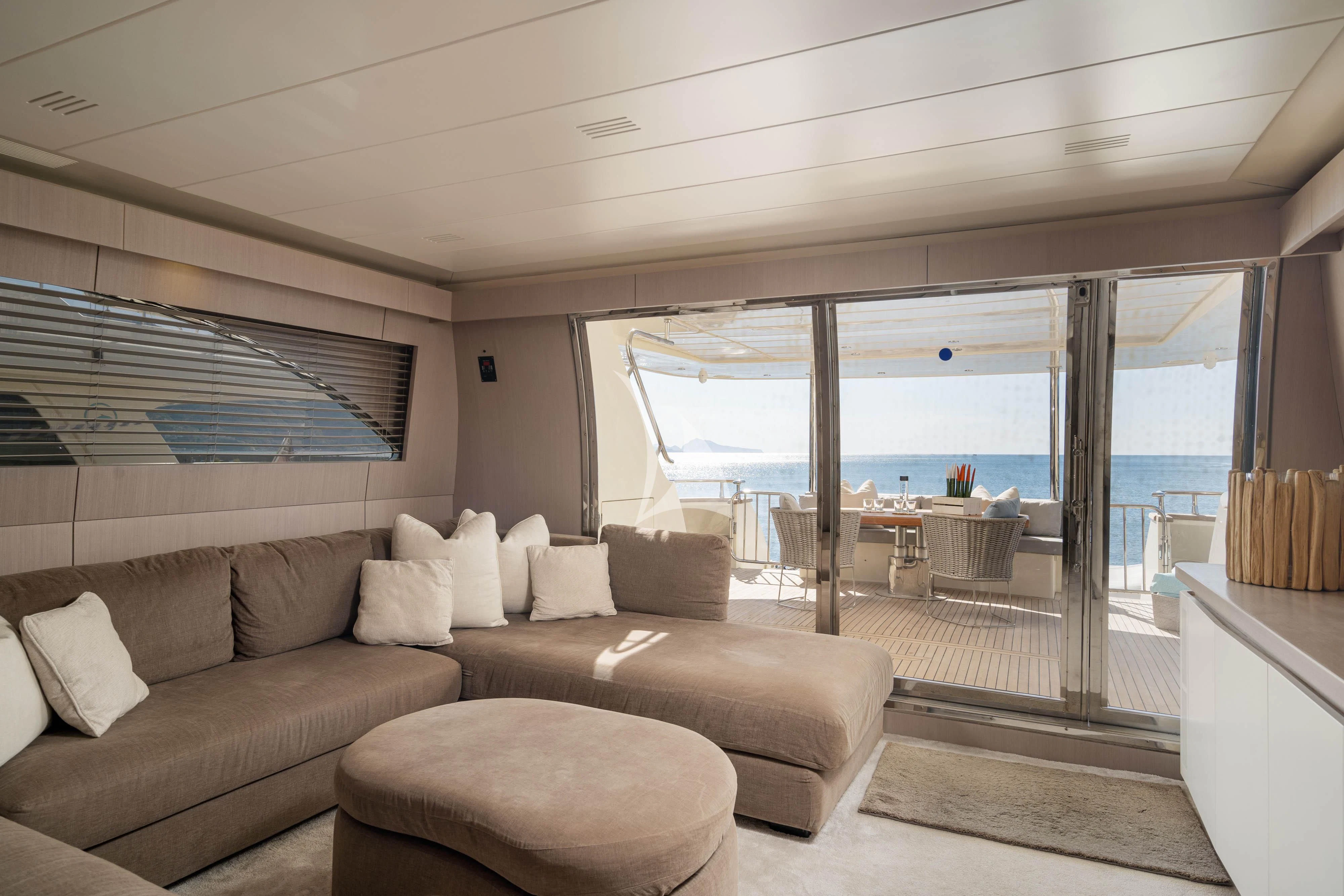 a living room with a large glass door aboard MINOU Yacht for Sale
