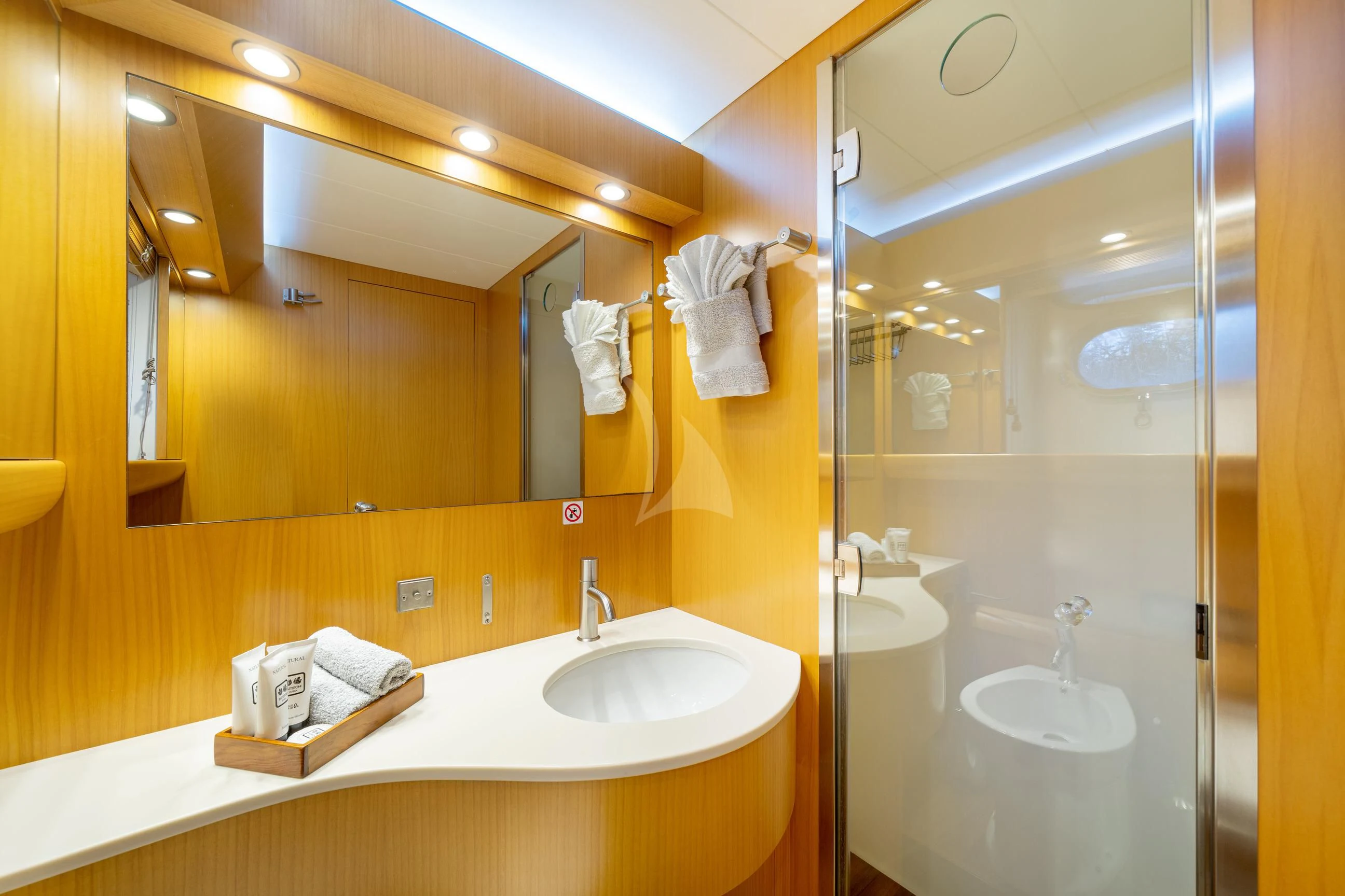 a bathroom with a large mirror aboard MINOU Yacht for Sale
