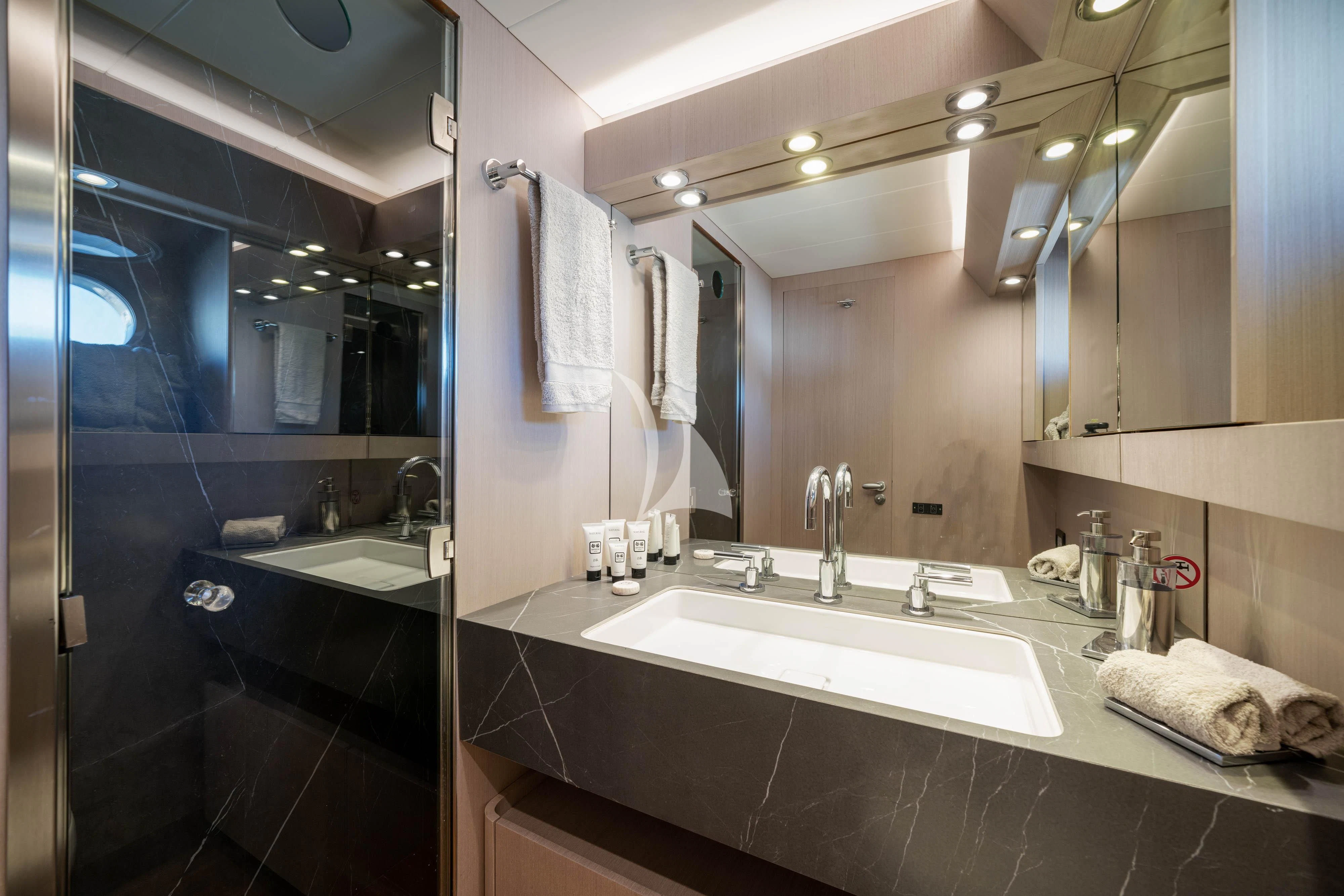 a bathroom with a large mirror aboard MINOU Yacht for Sale