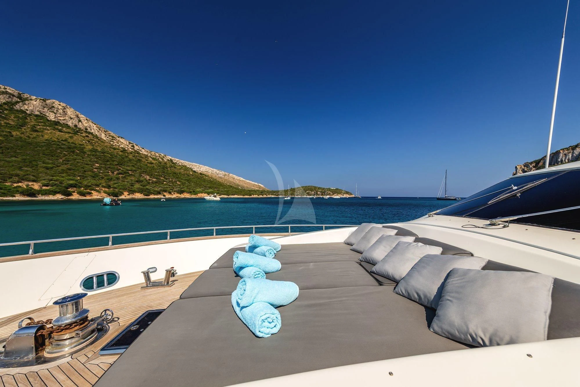 a large blue and white swimming pool next to a large body of water aboard MINOU Yacht for Sale