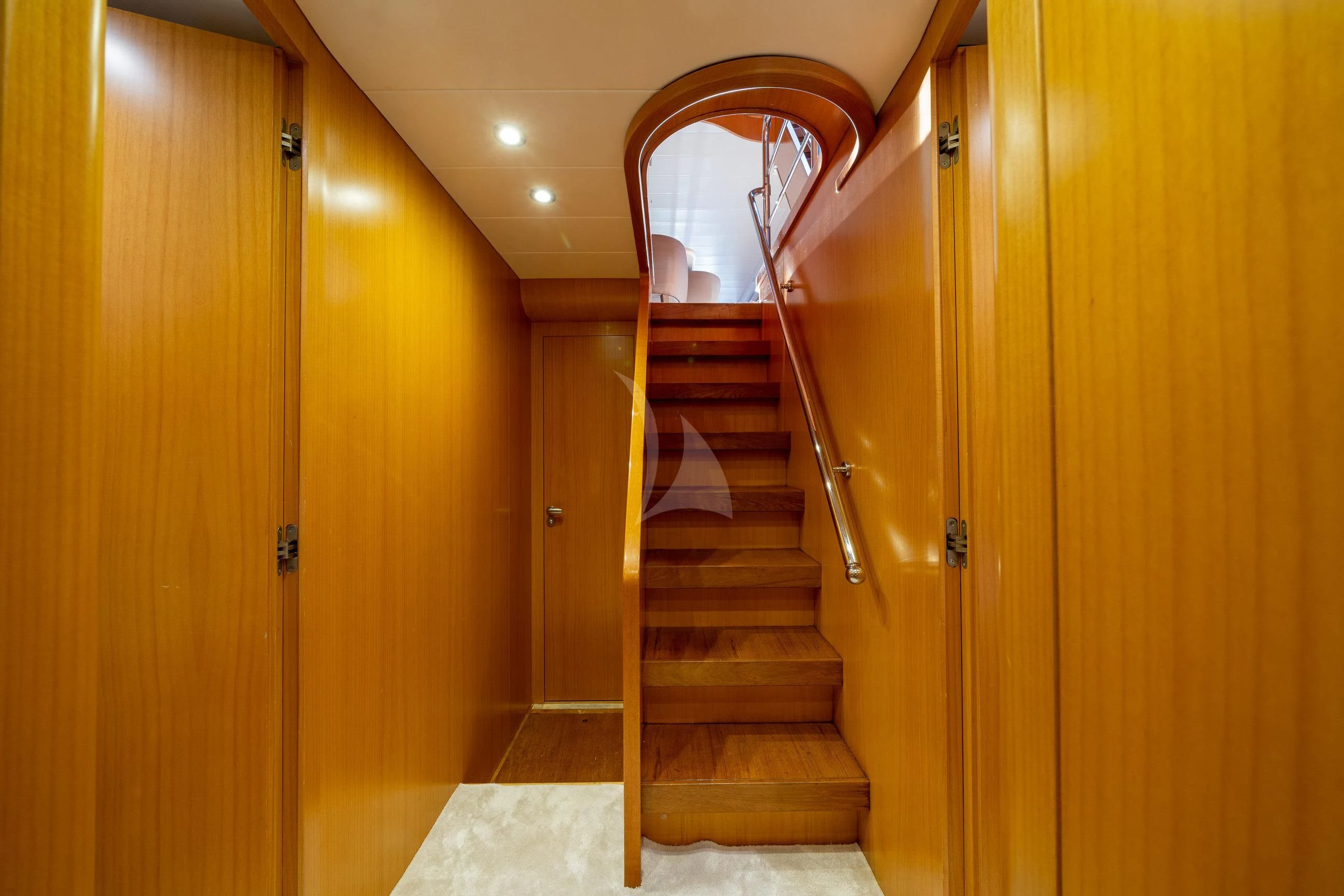 a wooden staircase in a room aboard MINOU Yacht for Sale