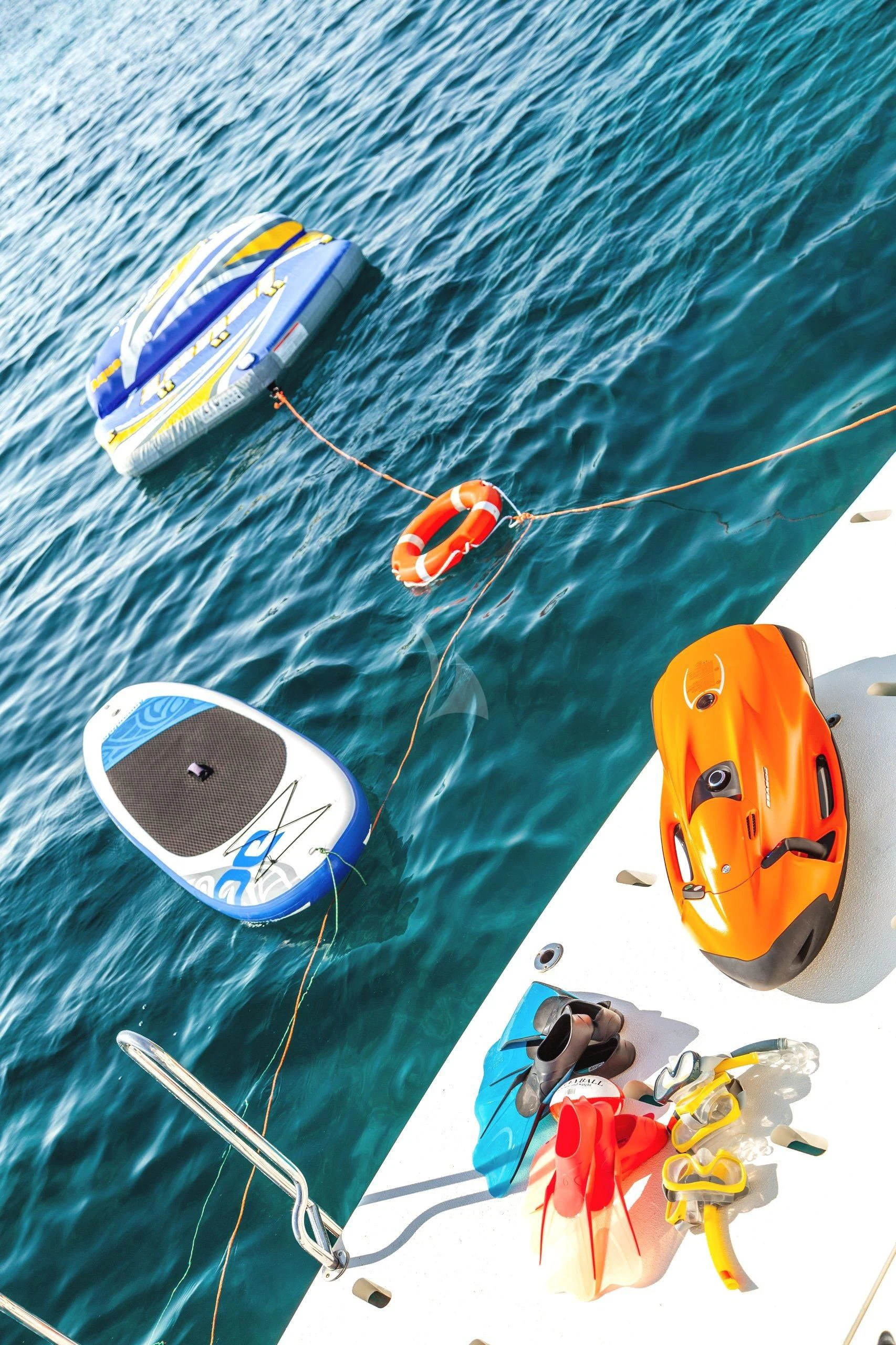 a group of objects on a beach aboard MINOU Yacht for Sale