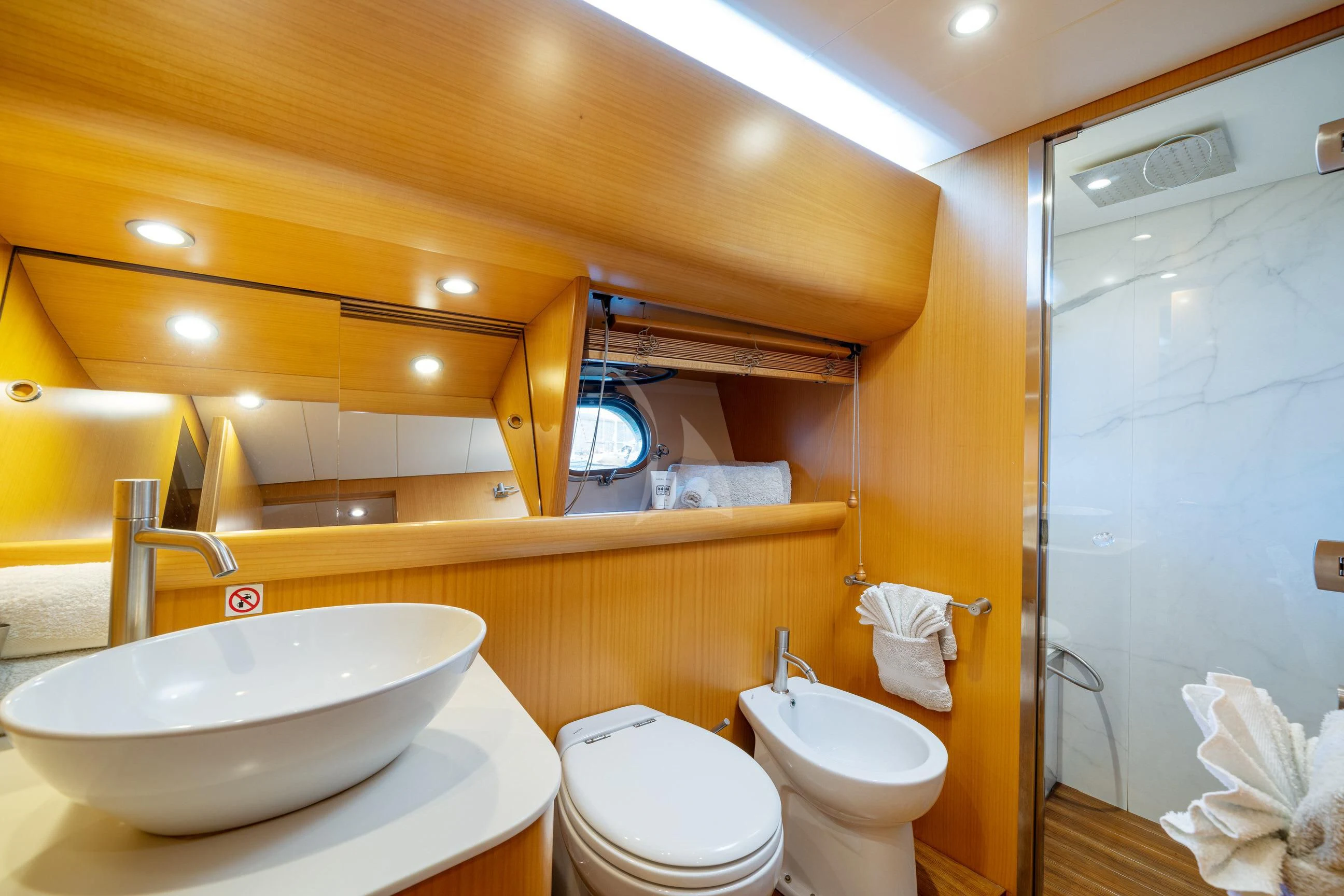 a bathroom with a sink toilet and a shower aboard MINOU Yacht for Sale