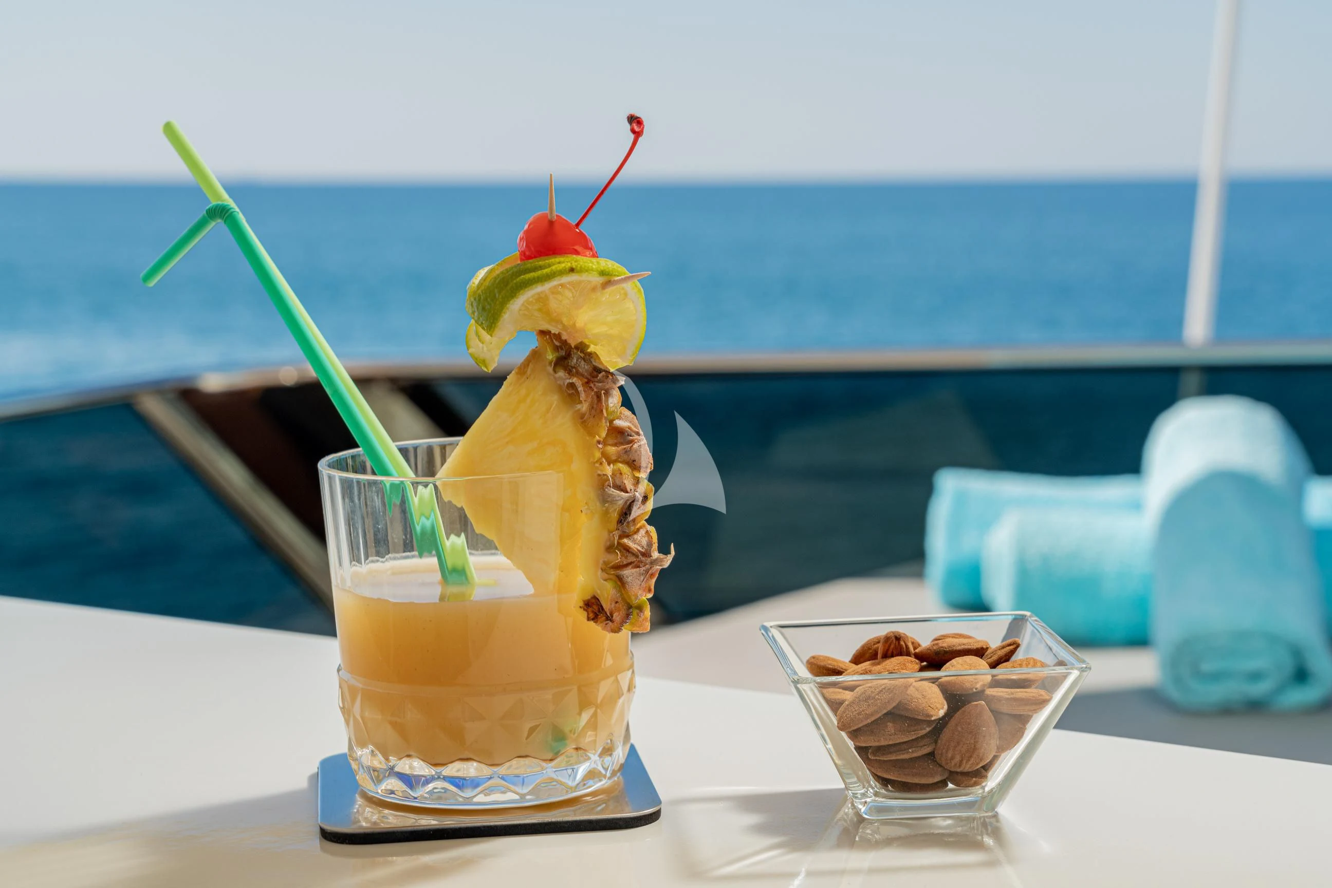 a glass with a drink and ice cream on a table aboard MINOU Yacht for Sale