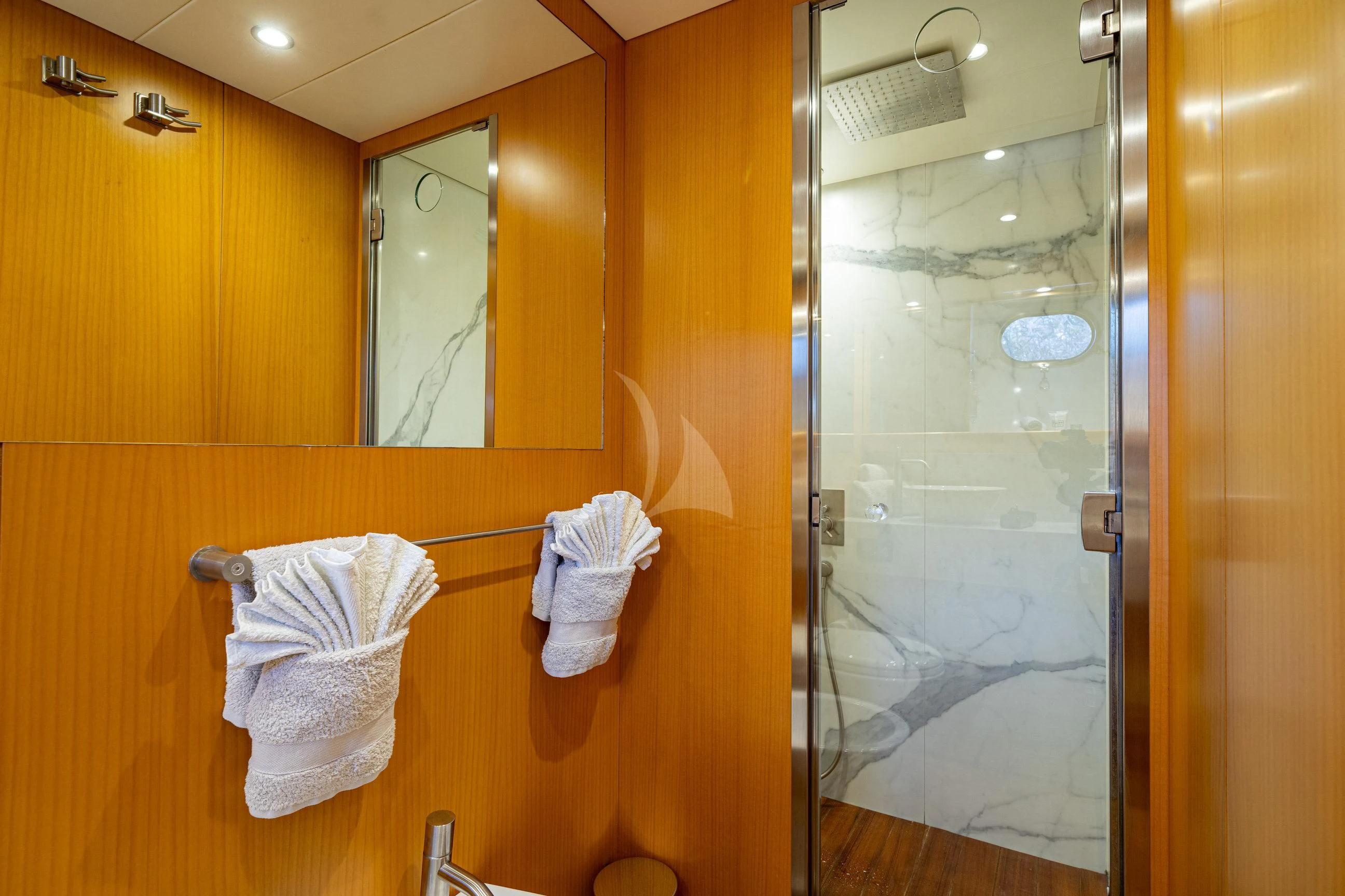 a bathroom with a glass shower aboard MINOU Yacht for Sale