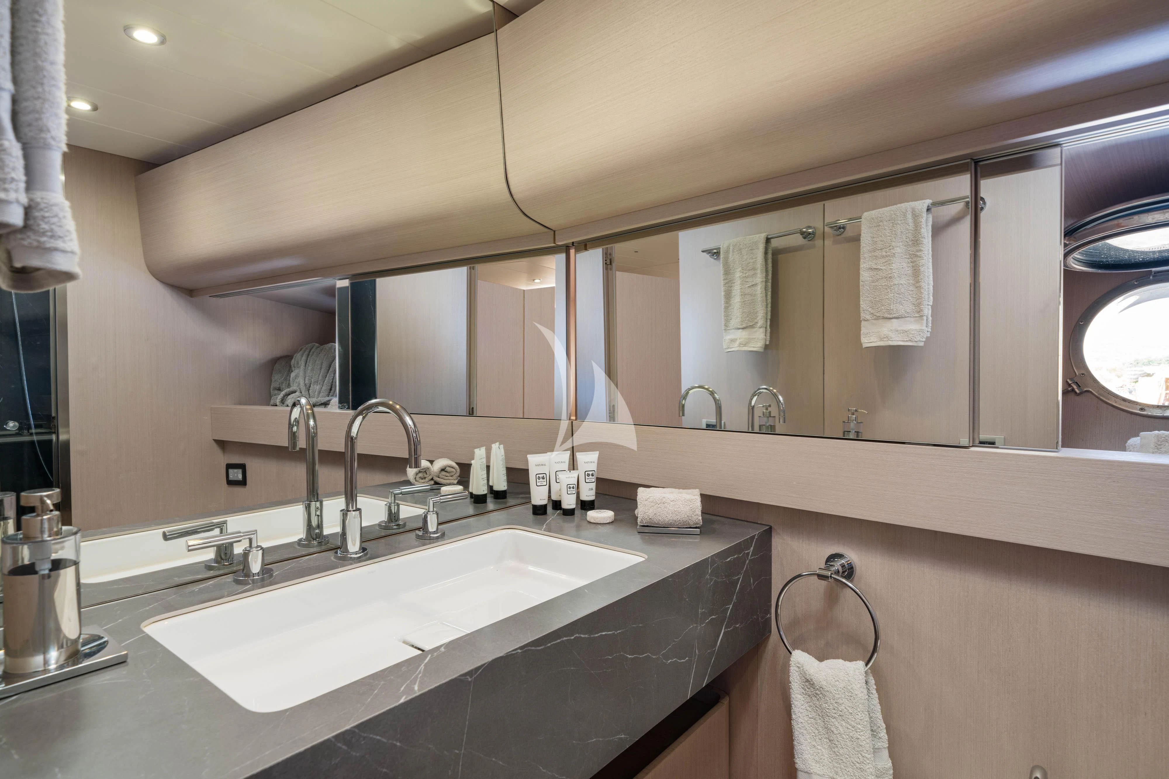 a bathroom with a sink and a mirror aboard MINOU Yacht for Sale