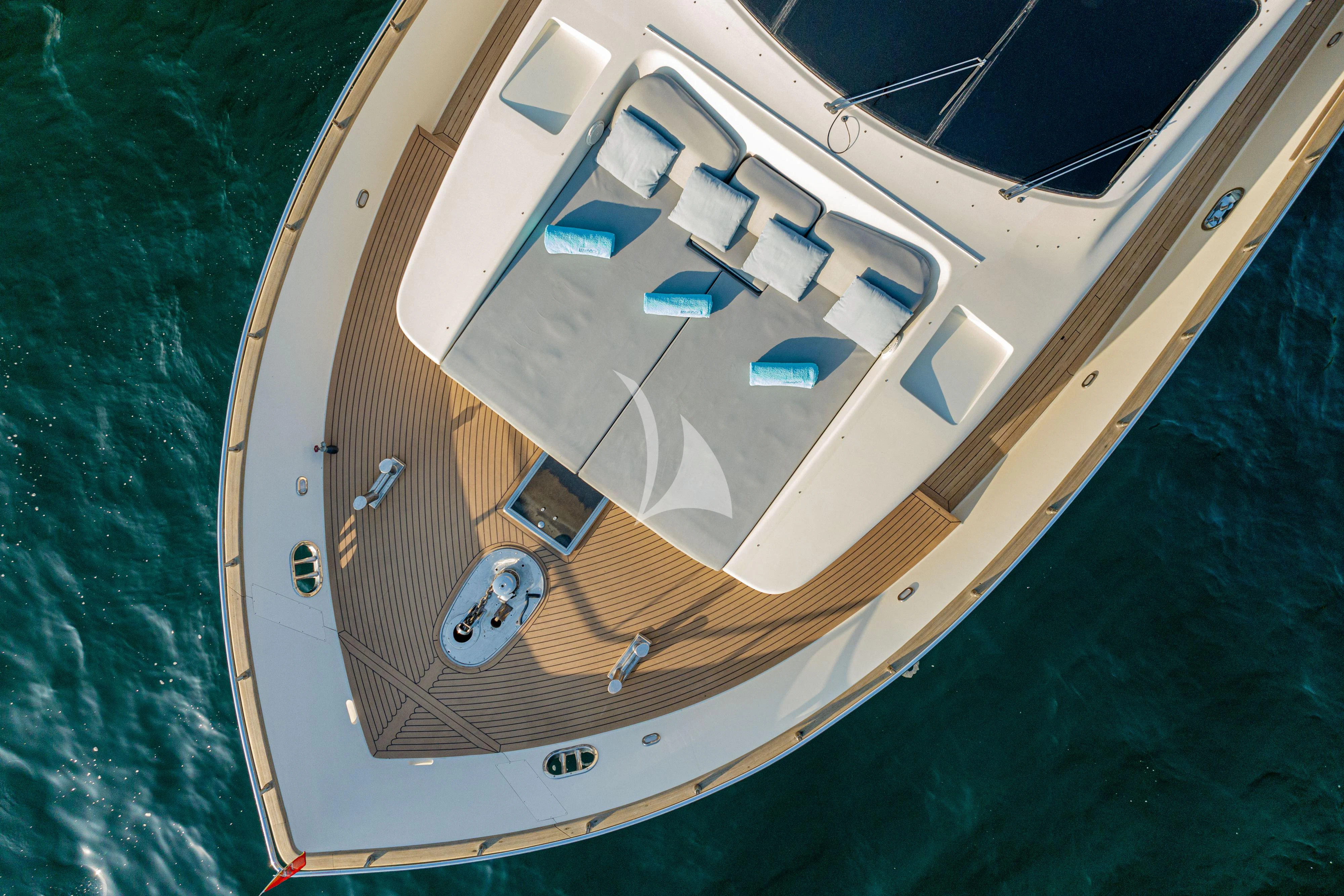 a wooden boat on the water aboard MINOU Yacht for Sale