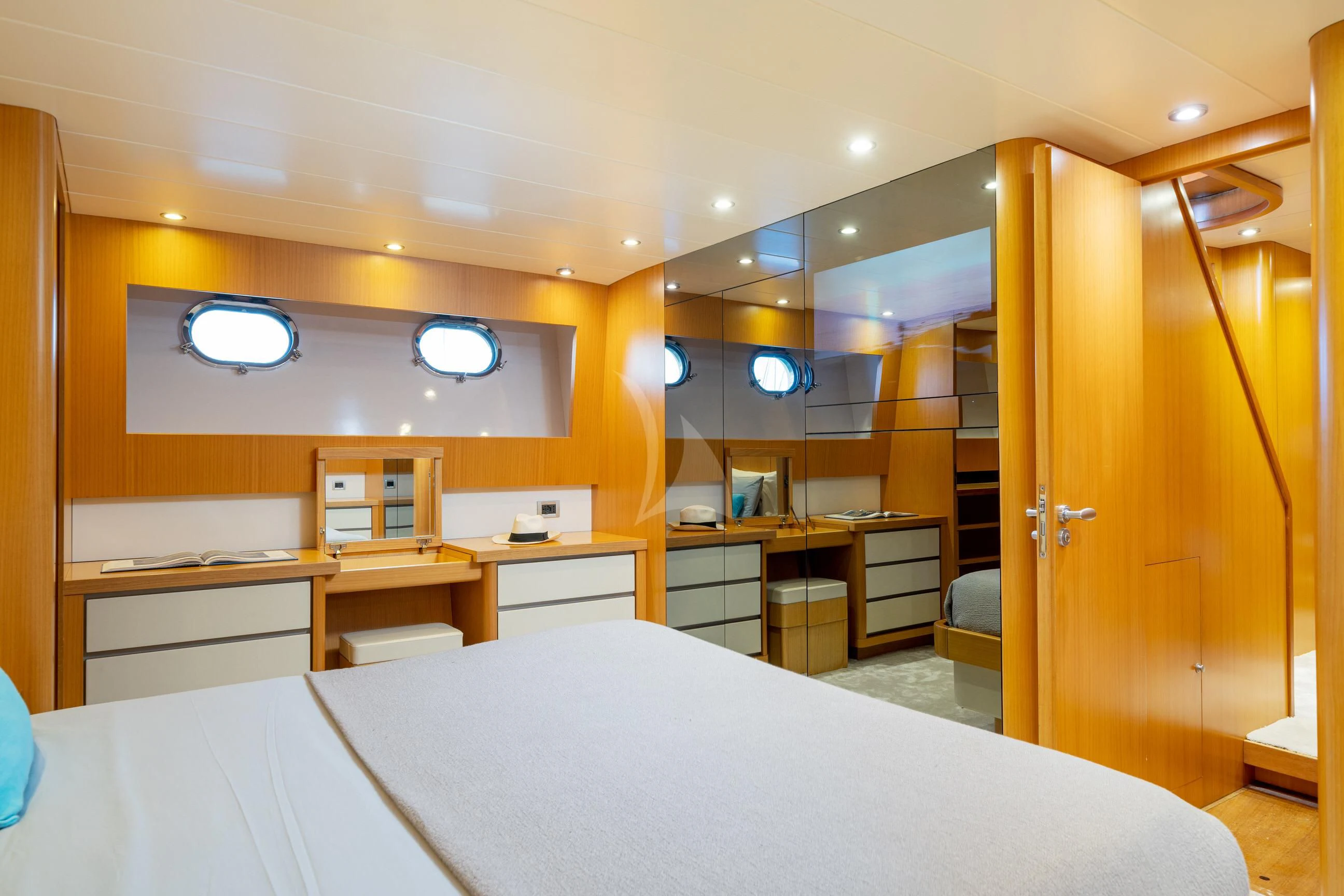 a room with a bed and desk aboard MINOU Yacht for Sale